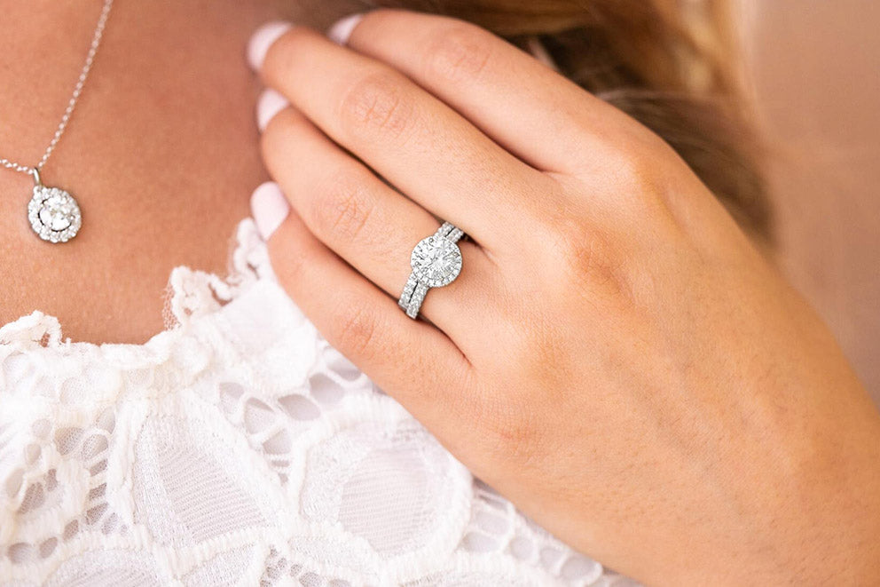 bride wearing necklace and ring