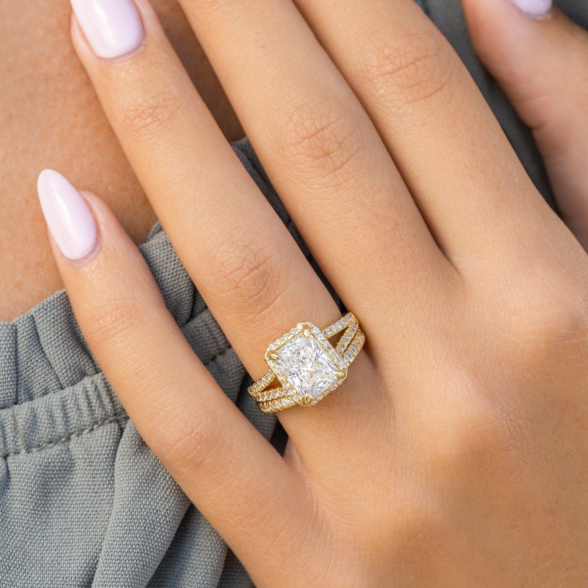 elegant gold 3.5 carat radiant cut wedding ring set on female hand