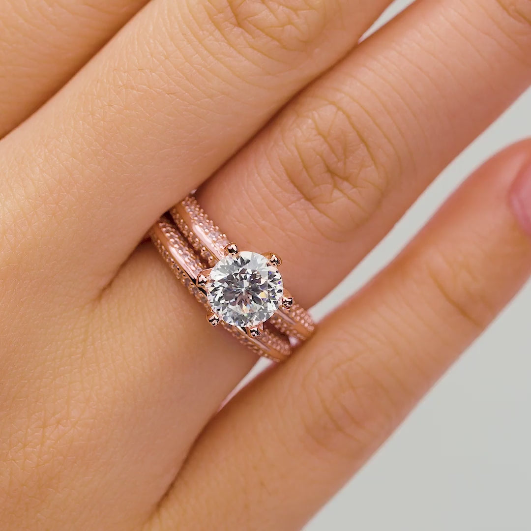 2 carat rose gold wedding ring set modeled on a female hand