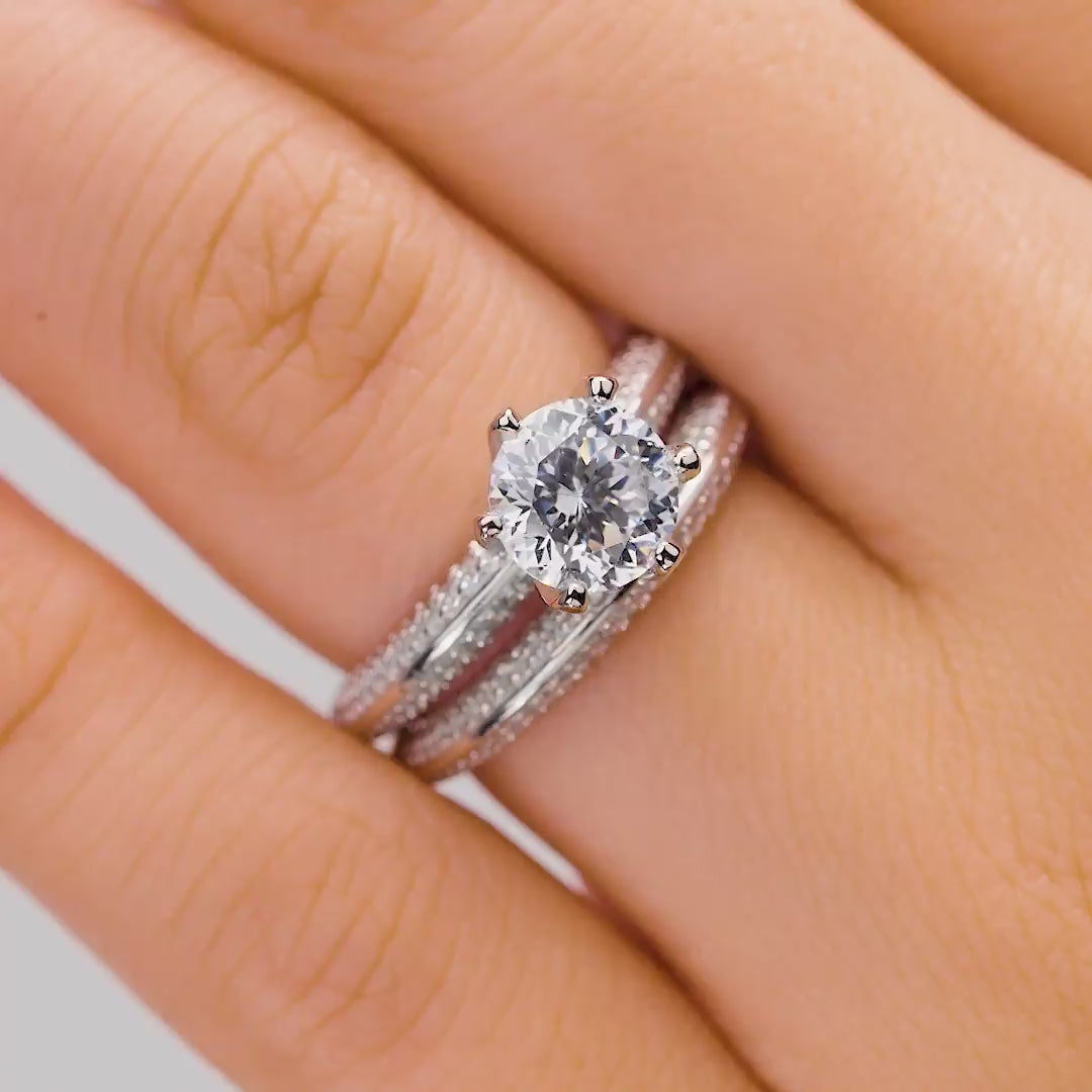 Six prong silver wedding ring set modeled on female hand