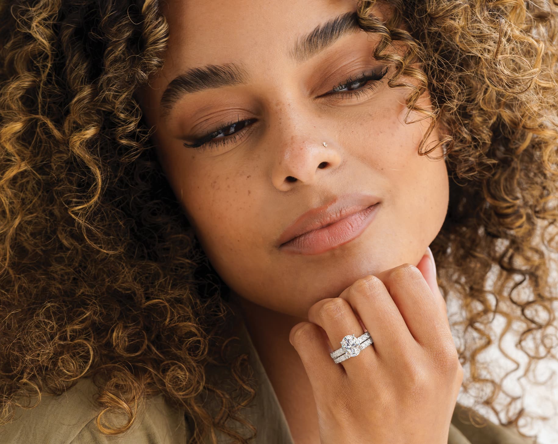 beautiful model wearing silver oval cut eternity wedding ring