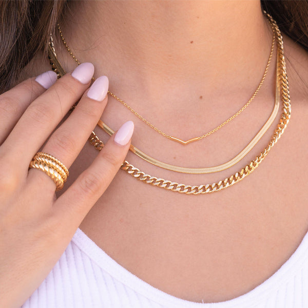 Beautiful gold layered necklaces on model