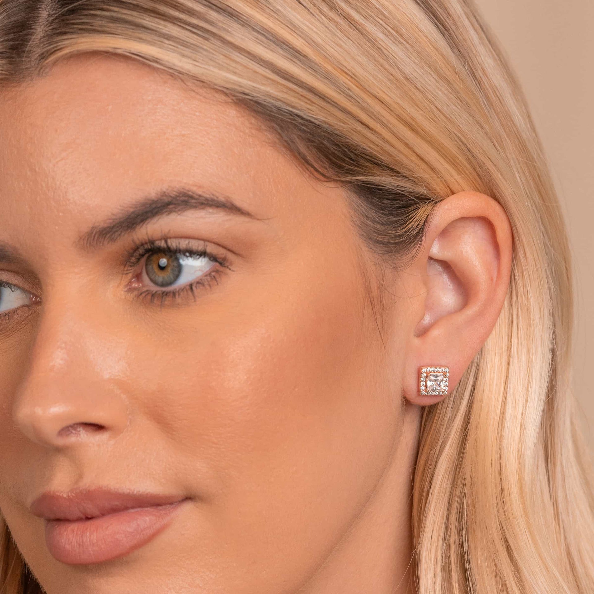 Rose gold stud earrings on model
