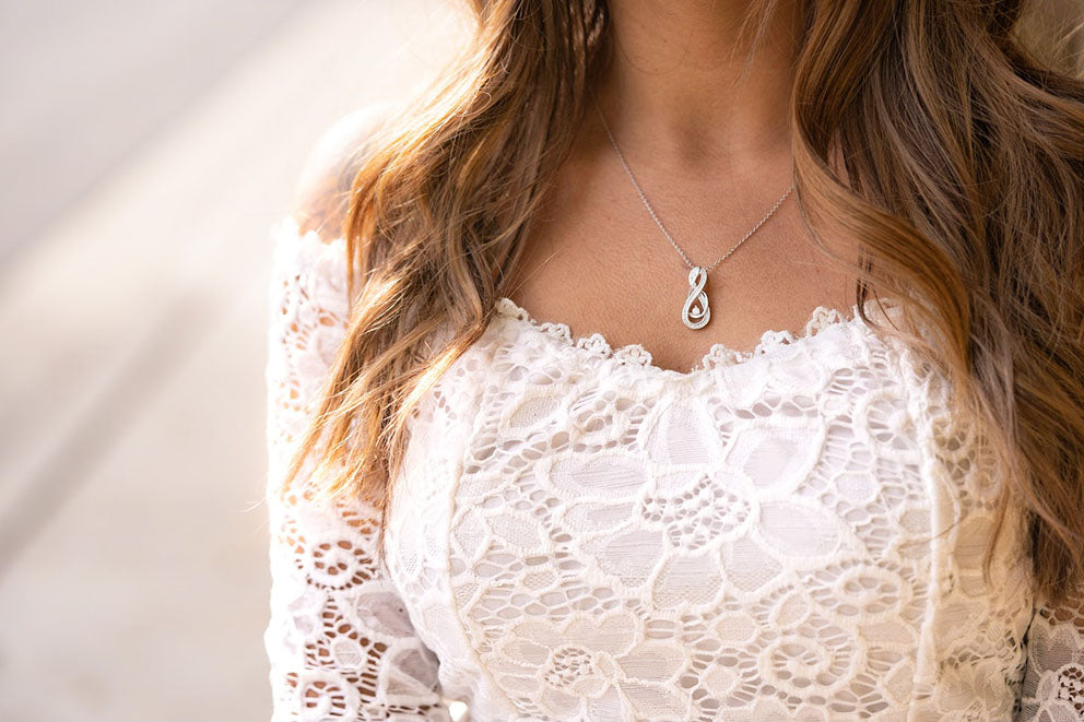 bride wearing a pendant necklace