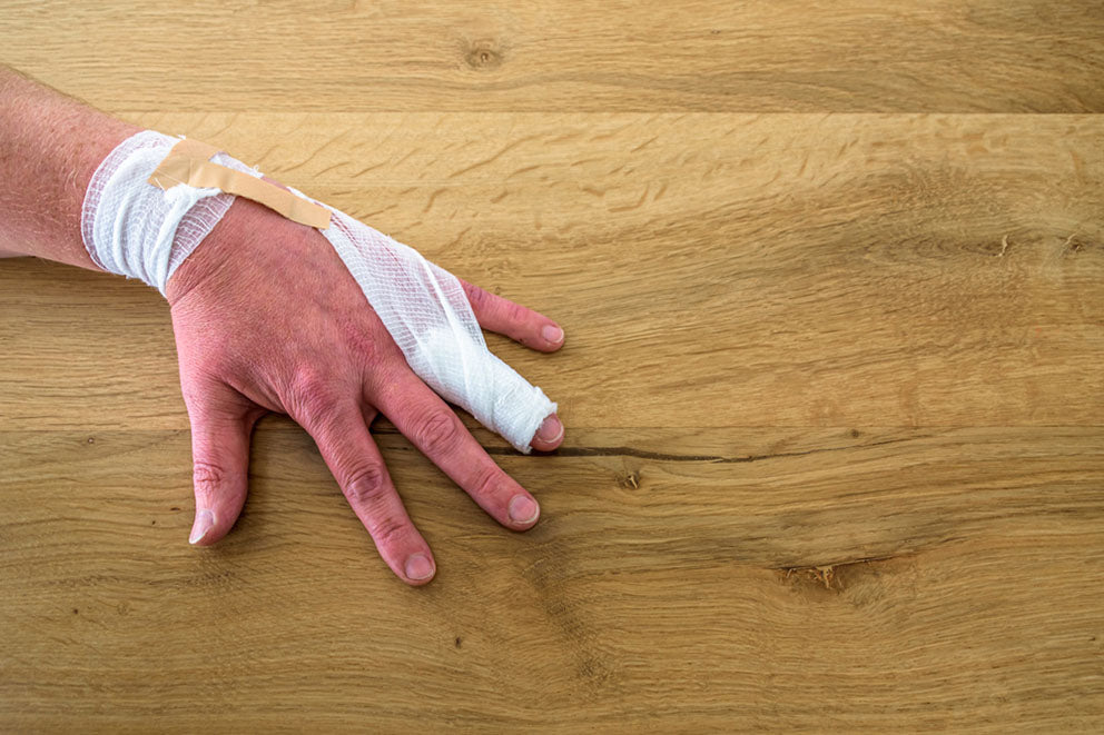 injured hand bandaged finger
