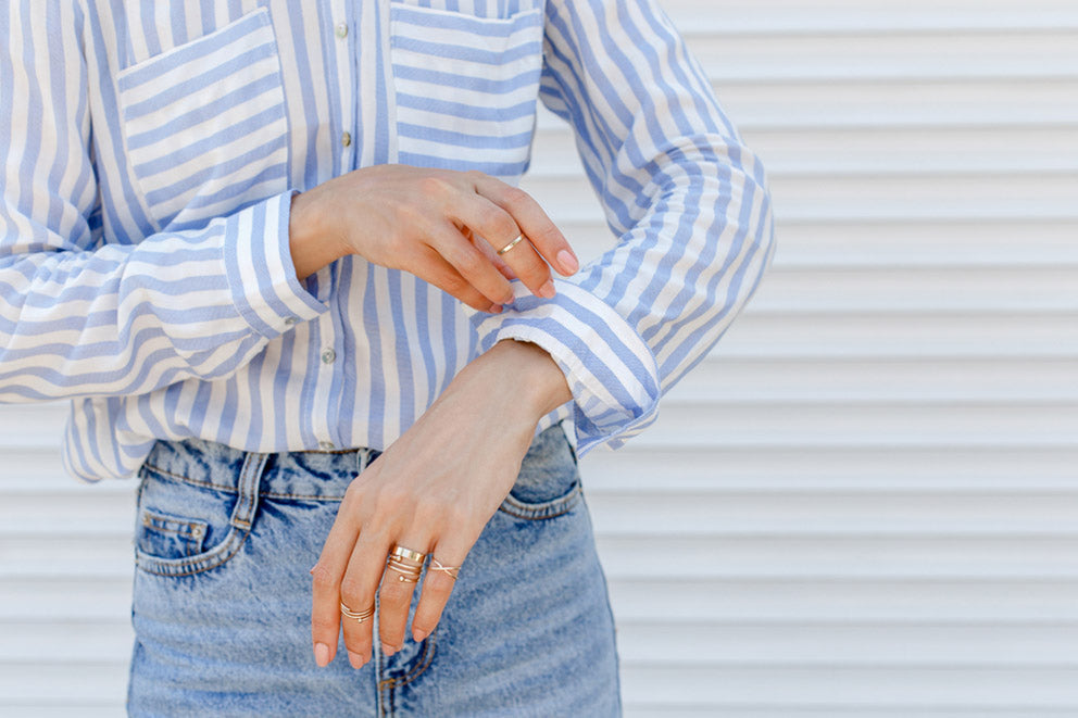 stylish woman wearing blue striped shirt