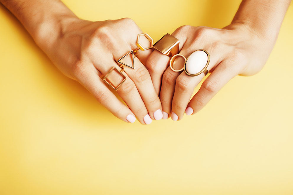 a woman wearing various rings