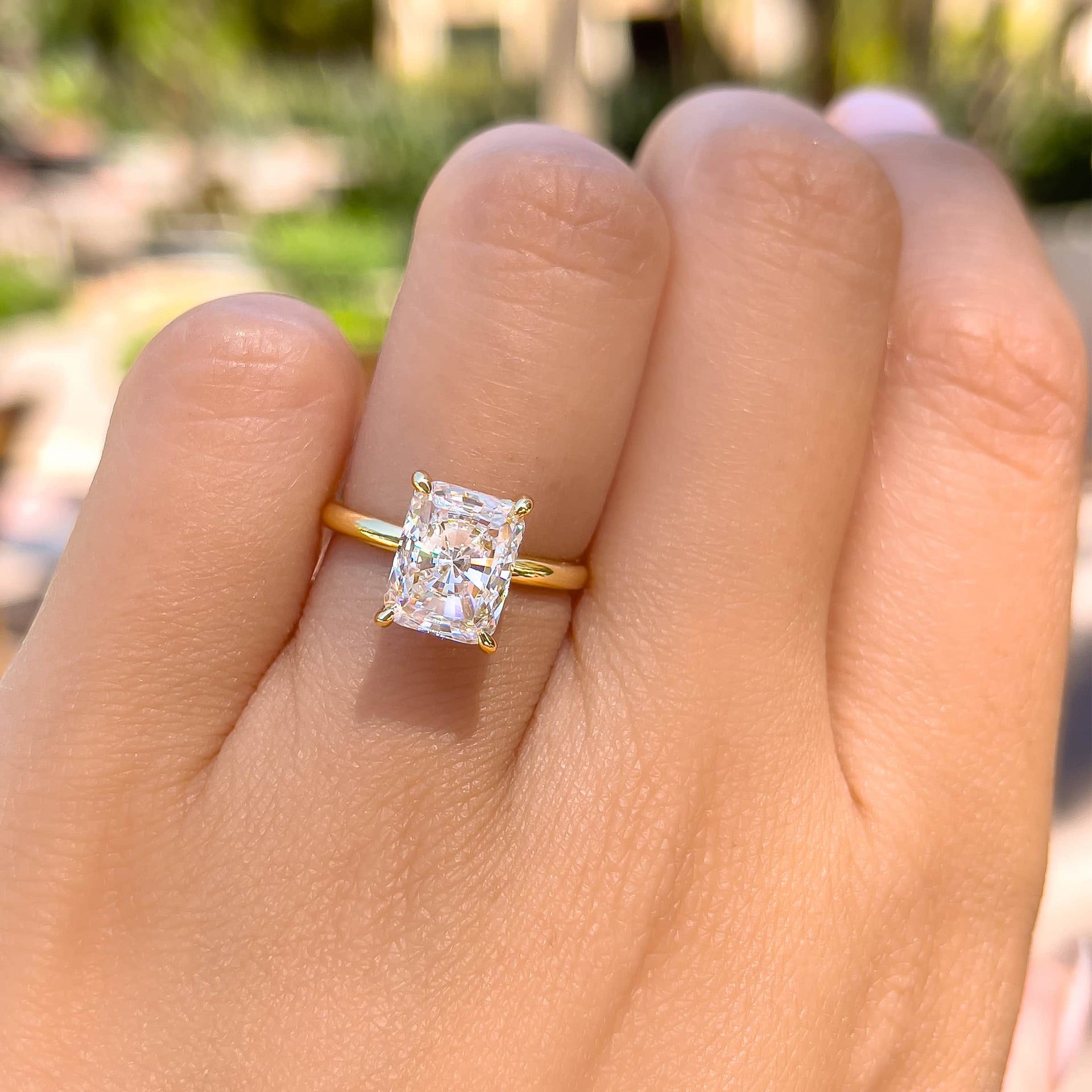 gorgeous 3 carat radiant cut solitaire engagement ring in gold on model