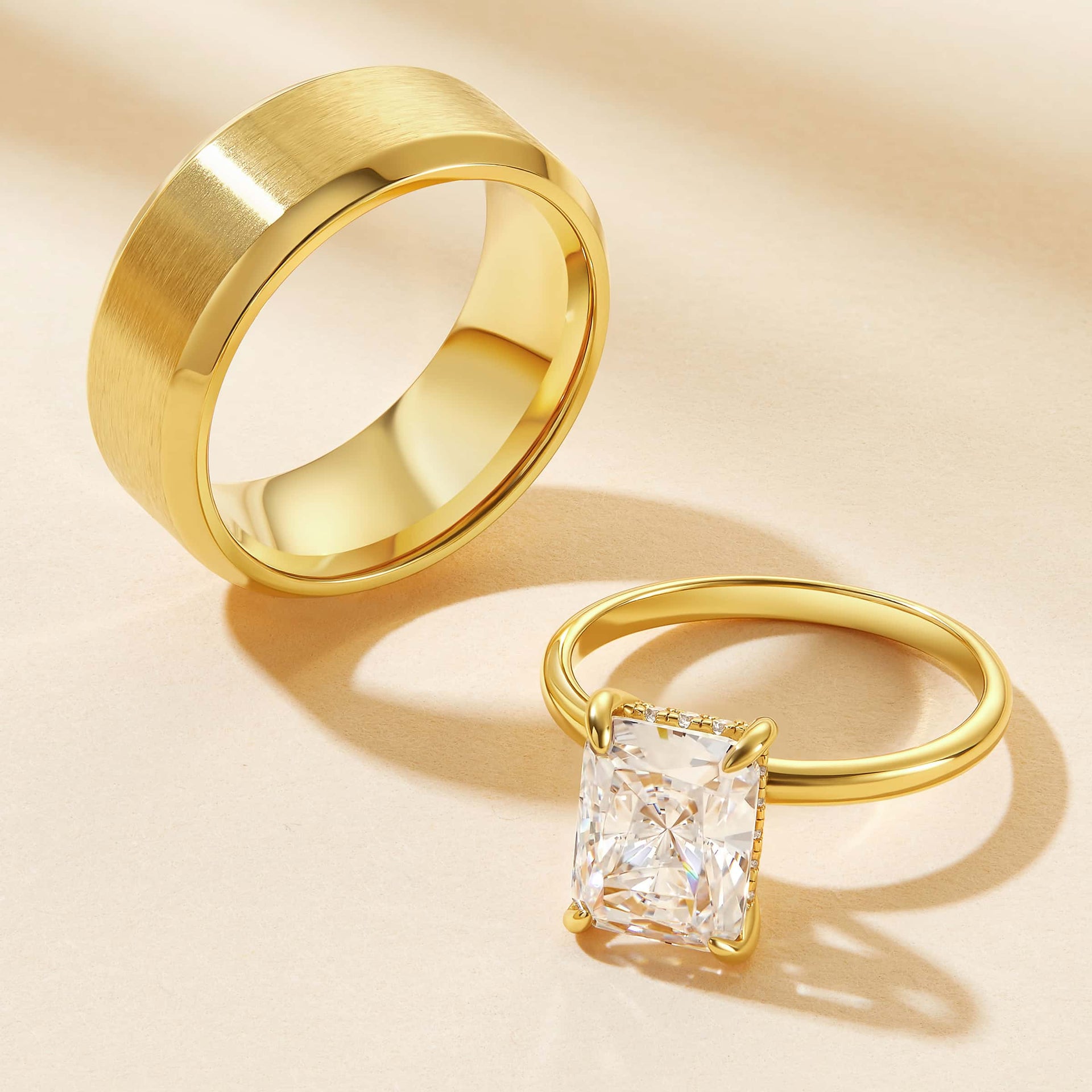 a stunning gold his and hers wedding set made of a solid titanium mens band and a radiant cut solitaire engagement ring