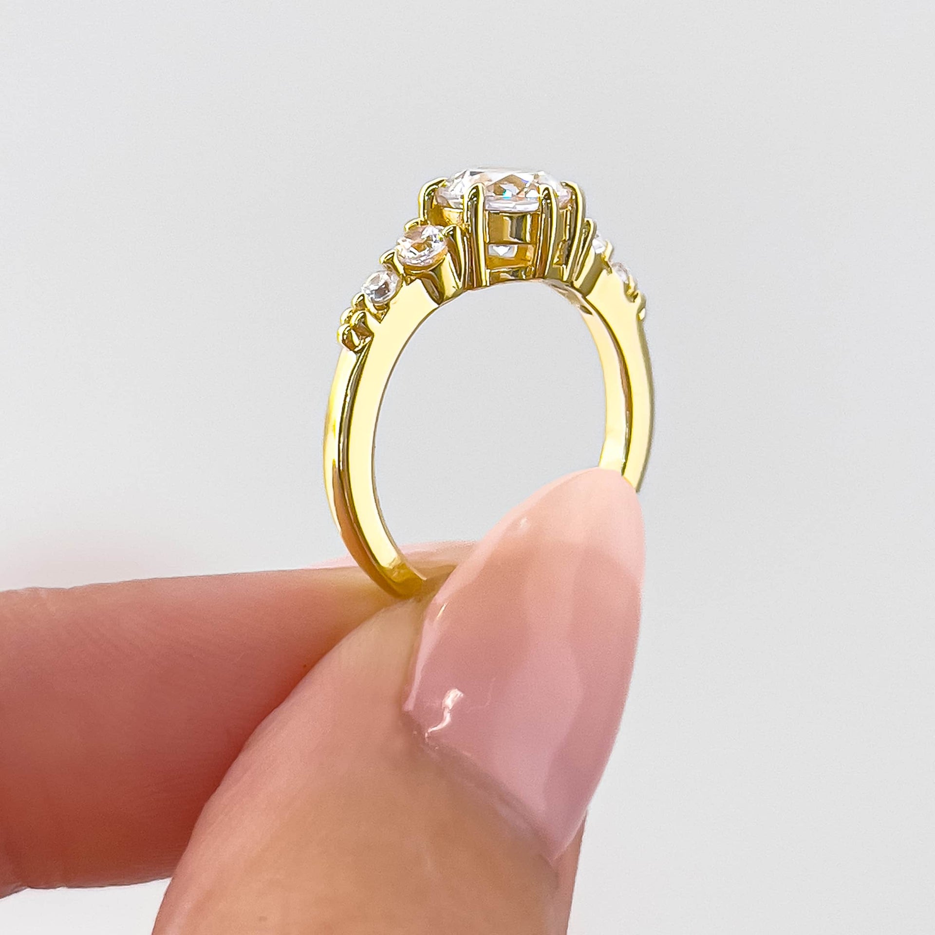 side view of gold round cut vintage style engagement ring