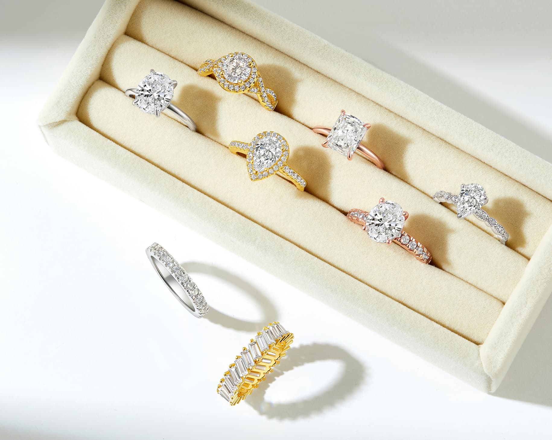 gorgeous array of engagement rings and wedding bands in silver, gold, and rose gold