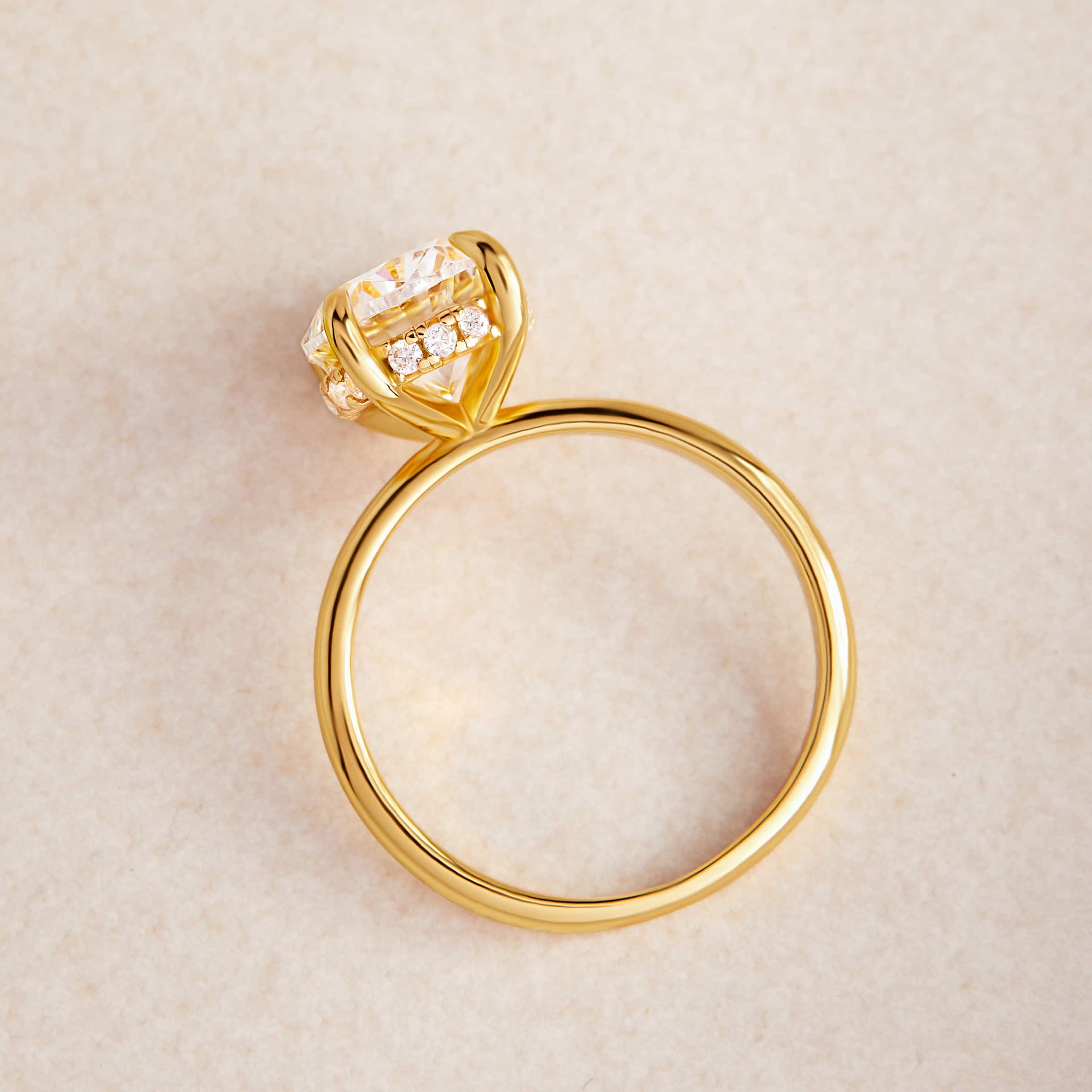 gold solitaire engagement ring with hidden halo