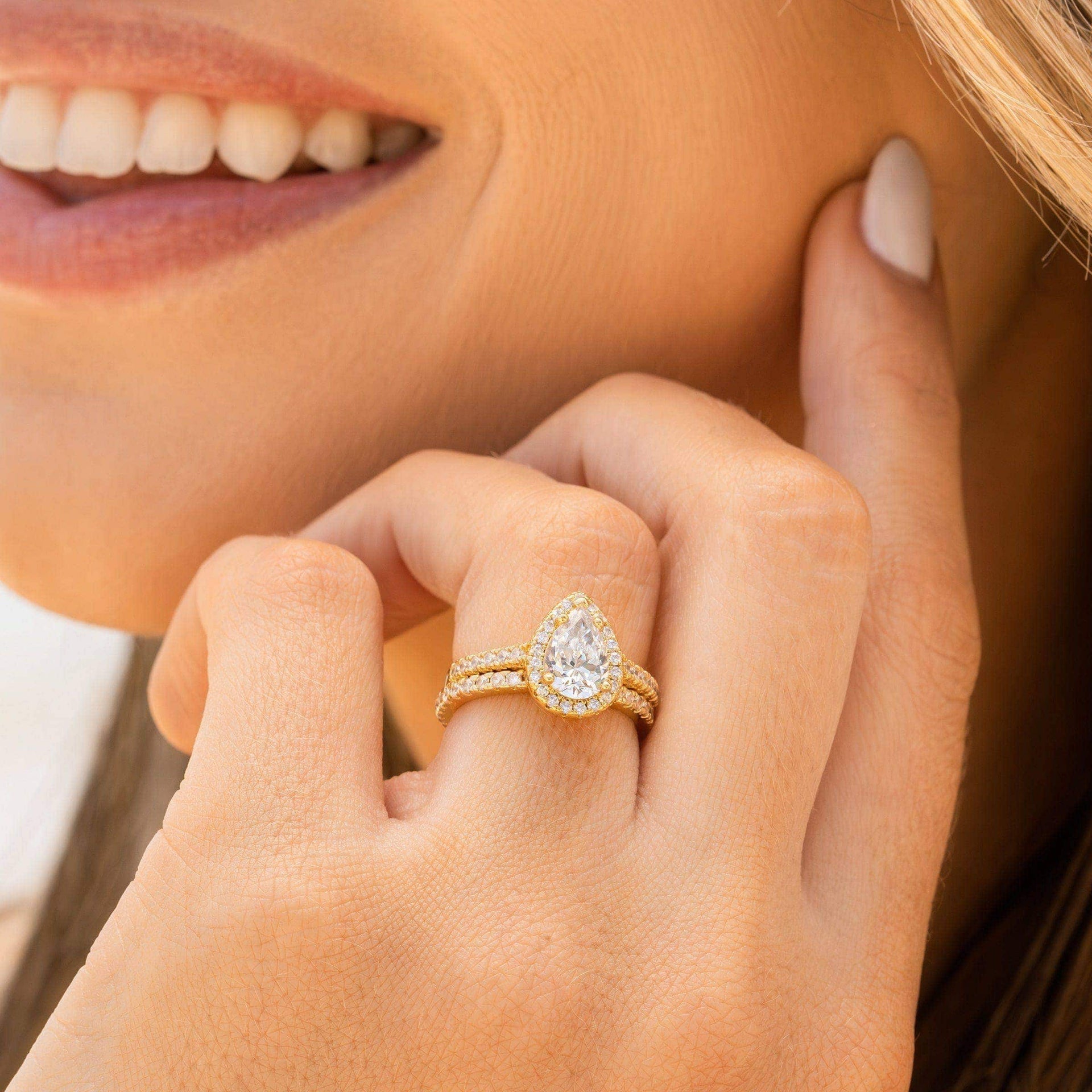 woman wearing gold shaped wedding ring set