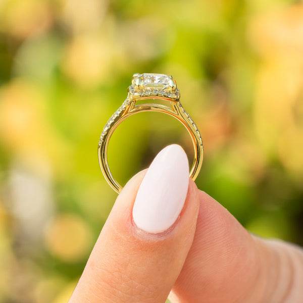 shiny side profile of gold radiant cut engagement ring 