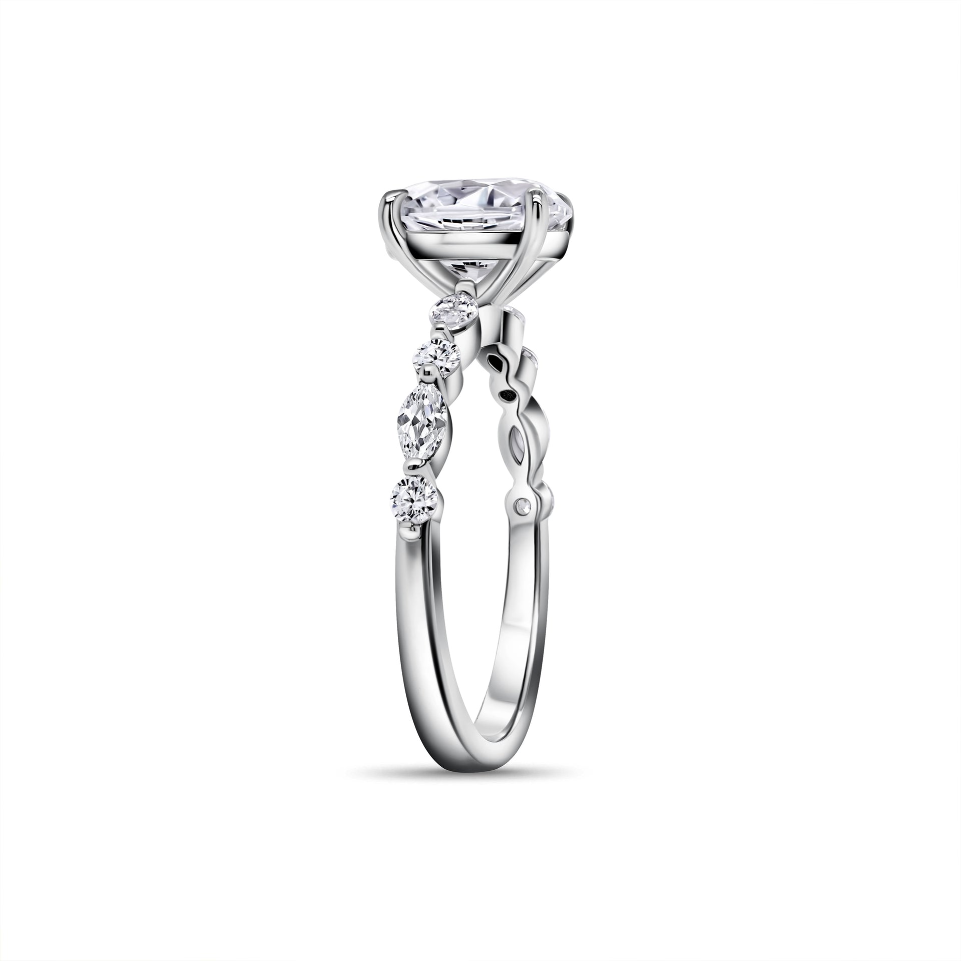 stunning partial open side view of silver oval engagement ring with uniquely designed half eternity band shown in silver