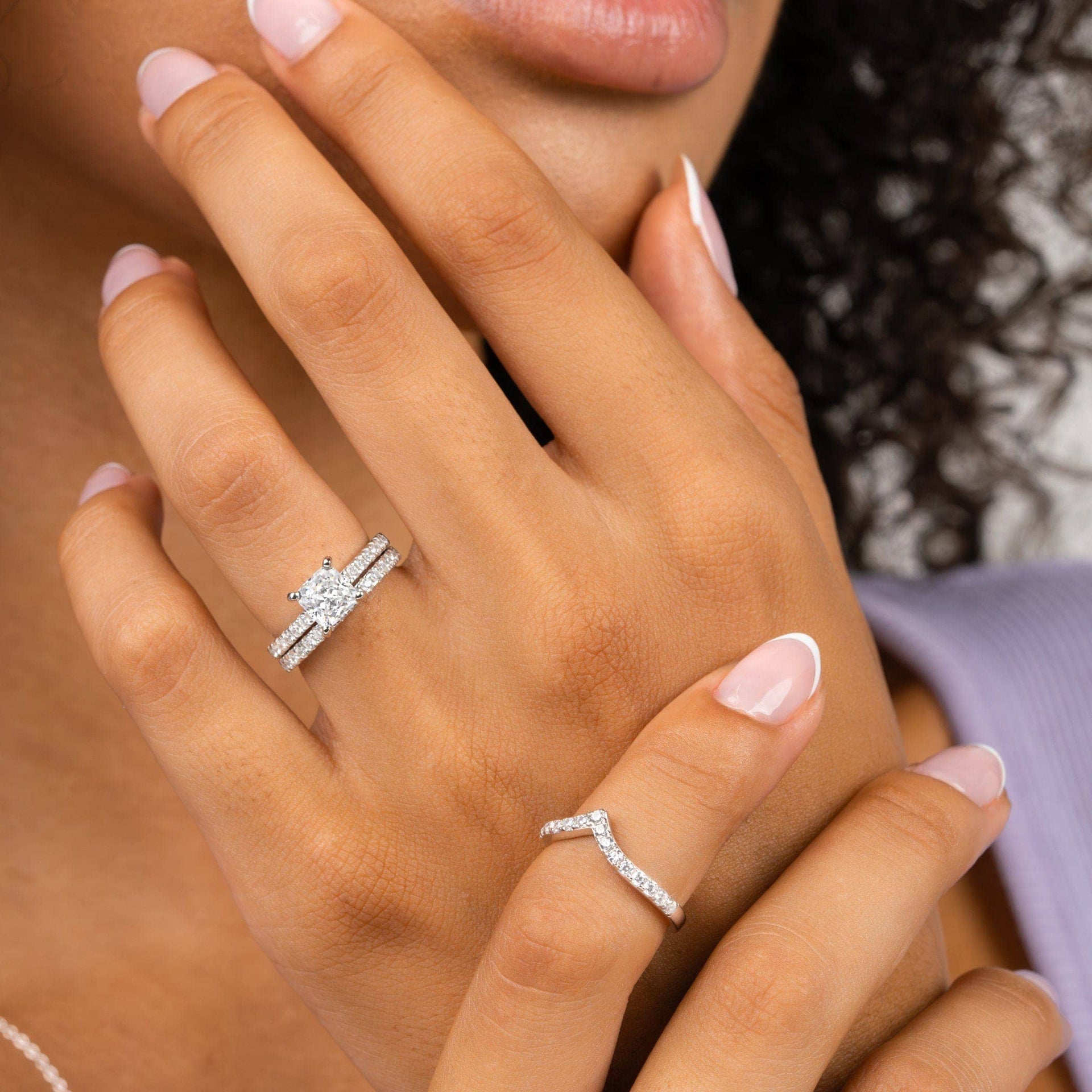 gorgeous silver wedding ring set on female hand