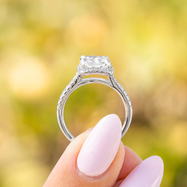 side profile of the evelyn engagement ring's half eternity band and halo detail