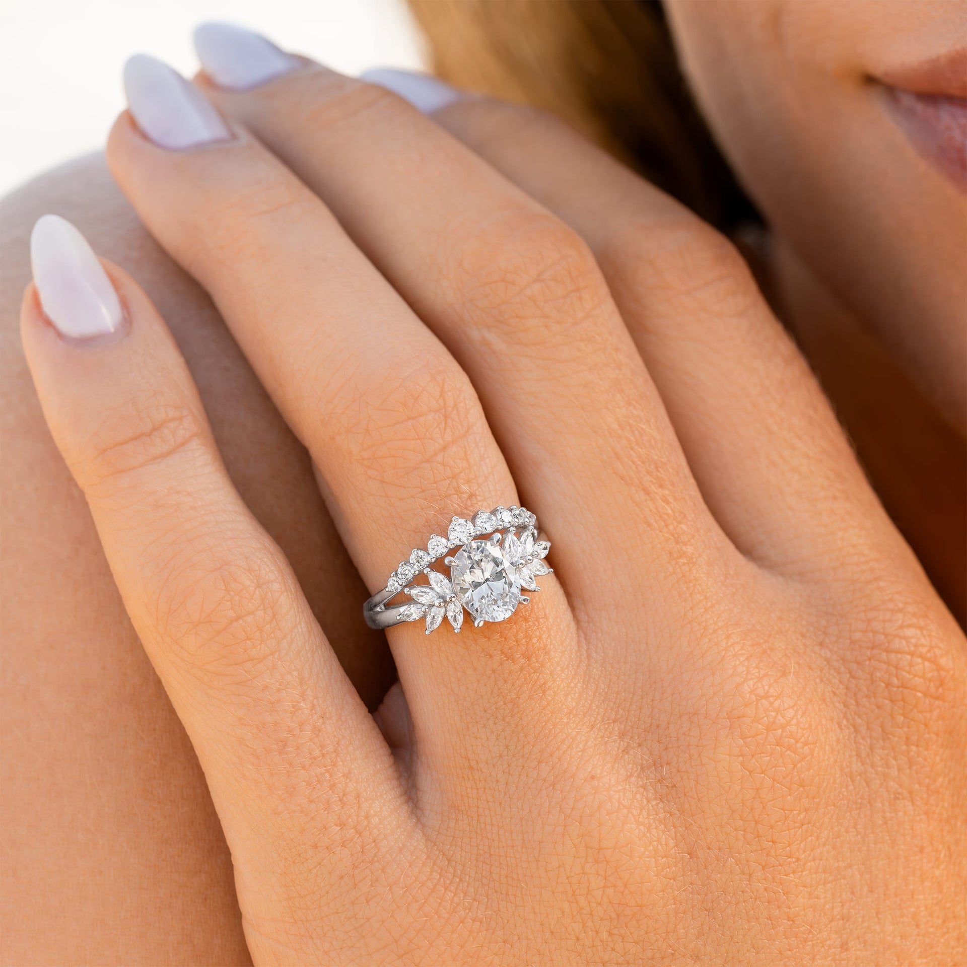 woman wearing silver vintage engagement ring 