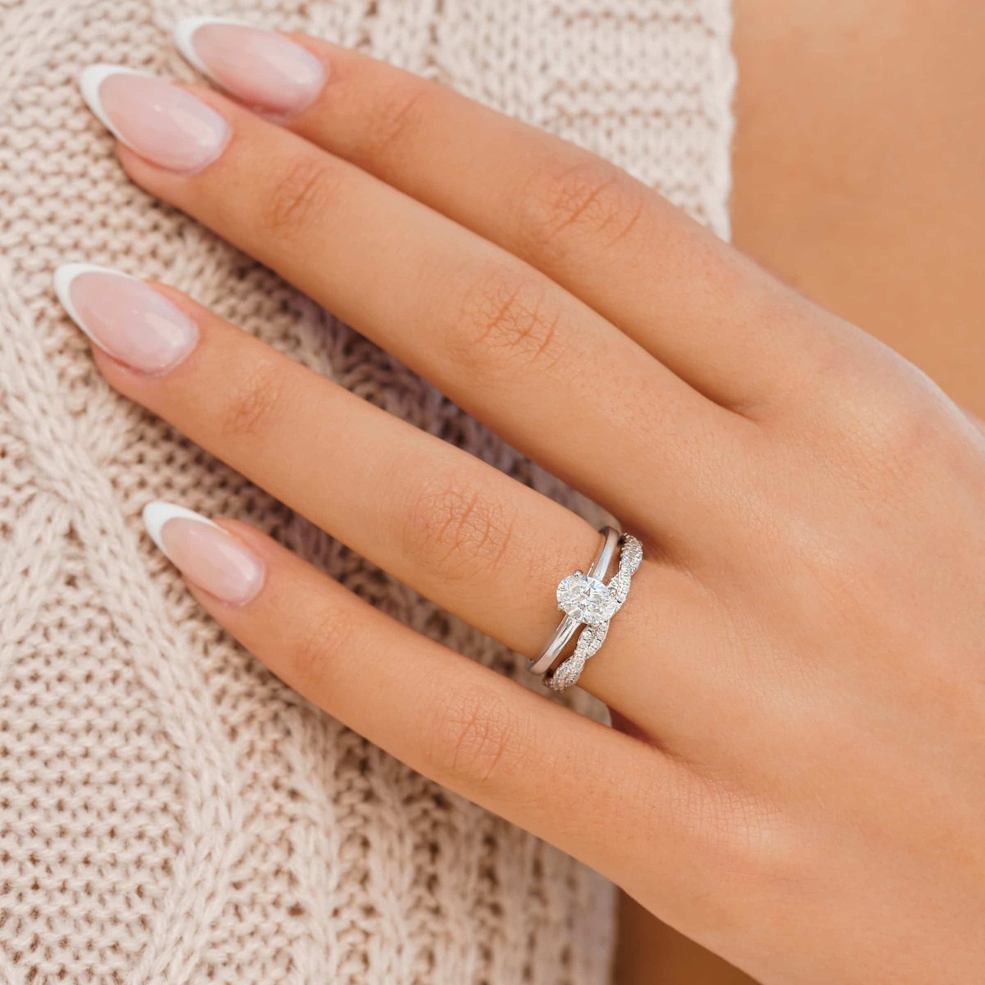 petite engagement ring on ladies hand