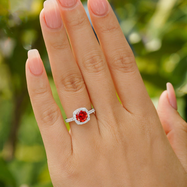 woman wearing stunning halo ruby engagement ring