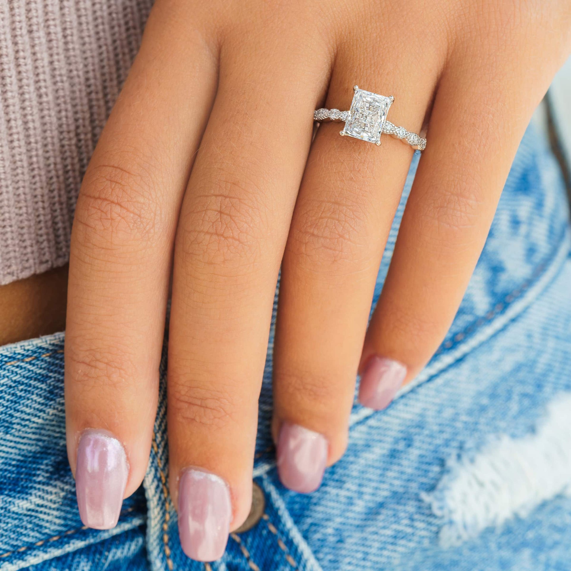 woman wearing silver vintage engagement ring