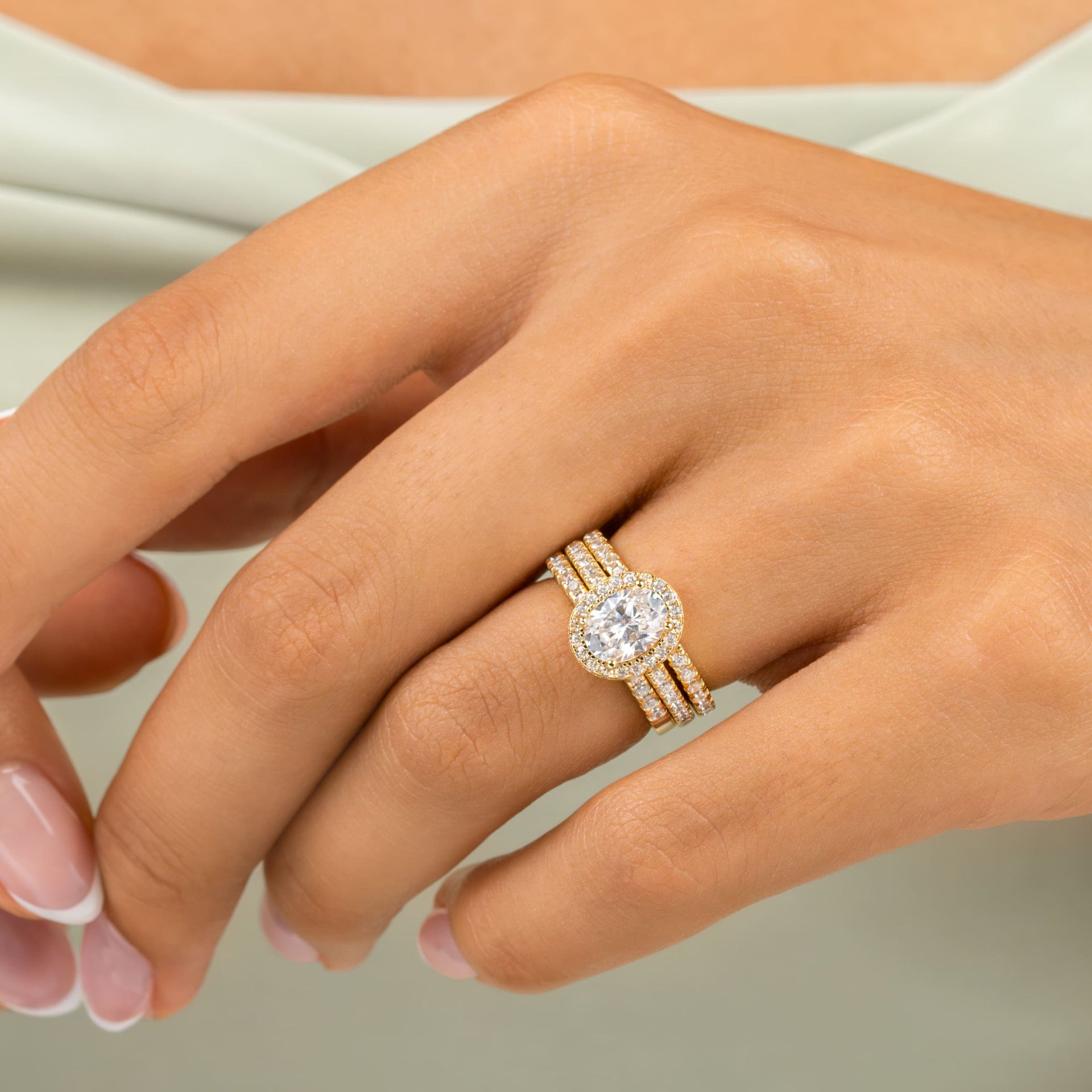 woman wearing belle engagement ring with triple stack