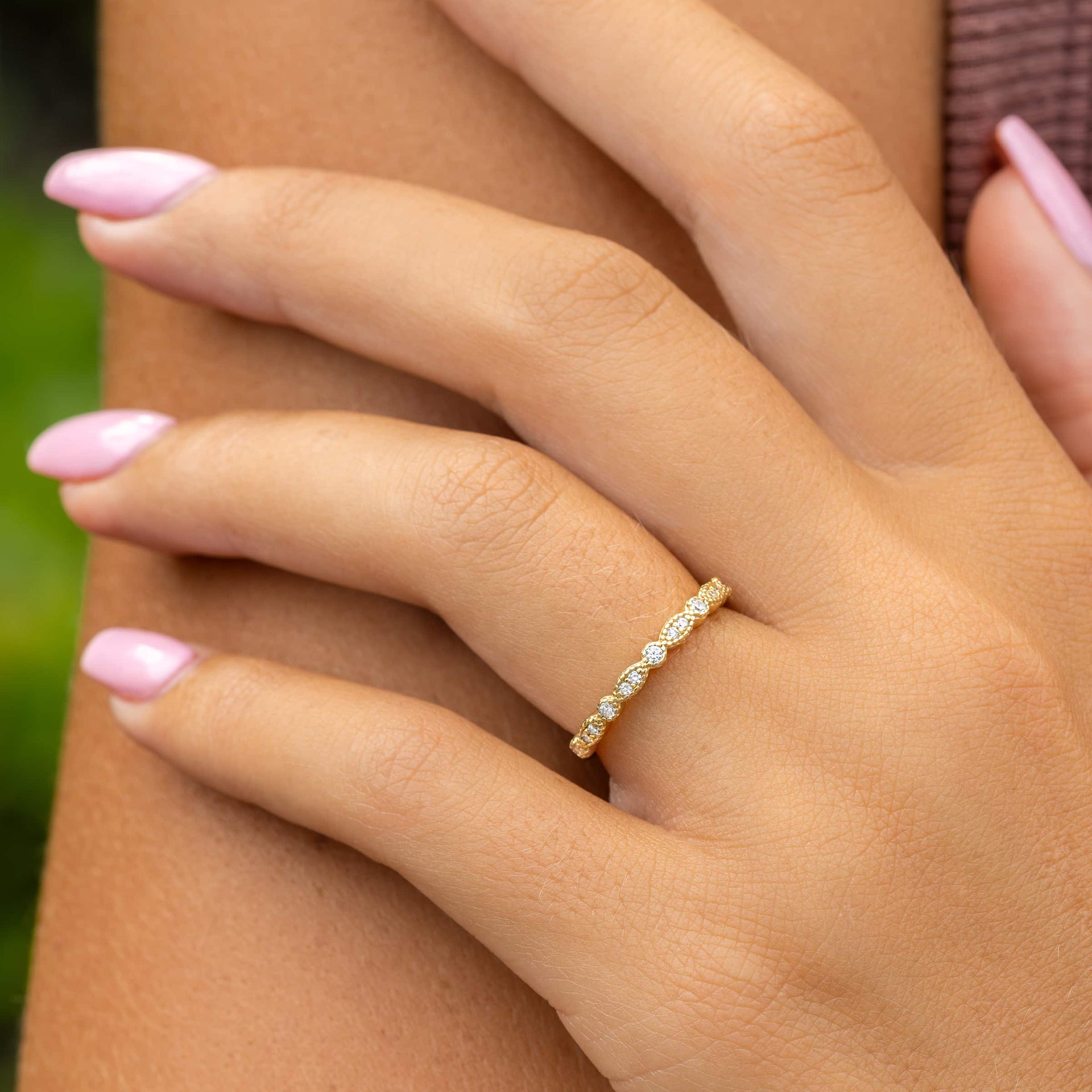 woman wearing affordable wedding band in gold