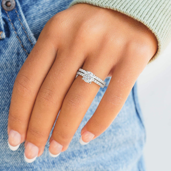 woman wearing silver star light wedding ring set