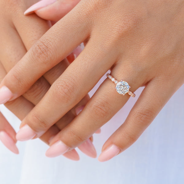 woman wearing rose gold vintage engagement ring