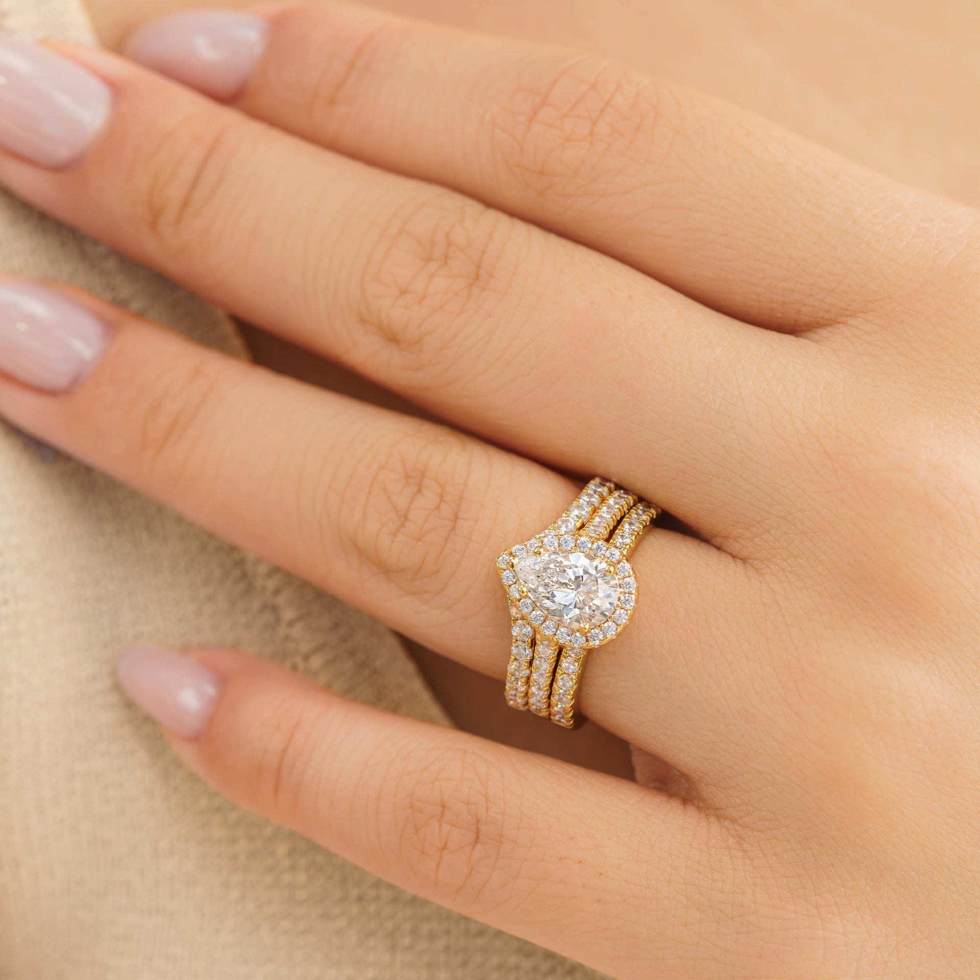 gorgeous triple stack pear shaped engagement ring