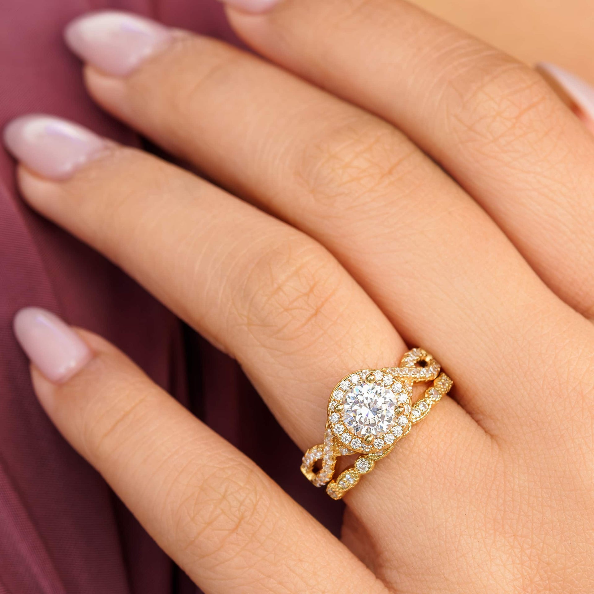 woman wearing gold vintage engagement ring with vintage wedding band