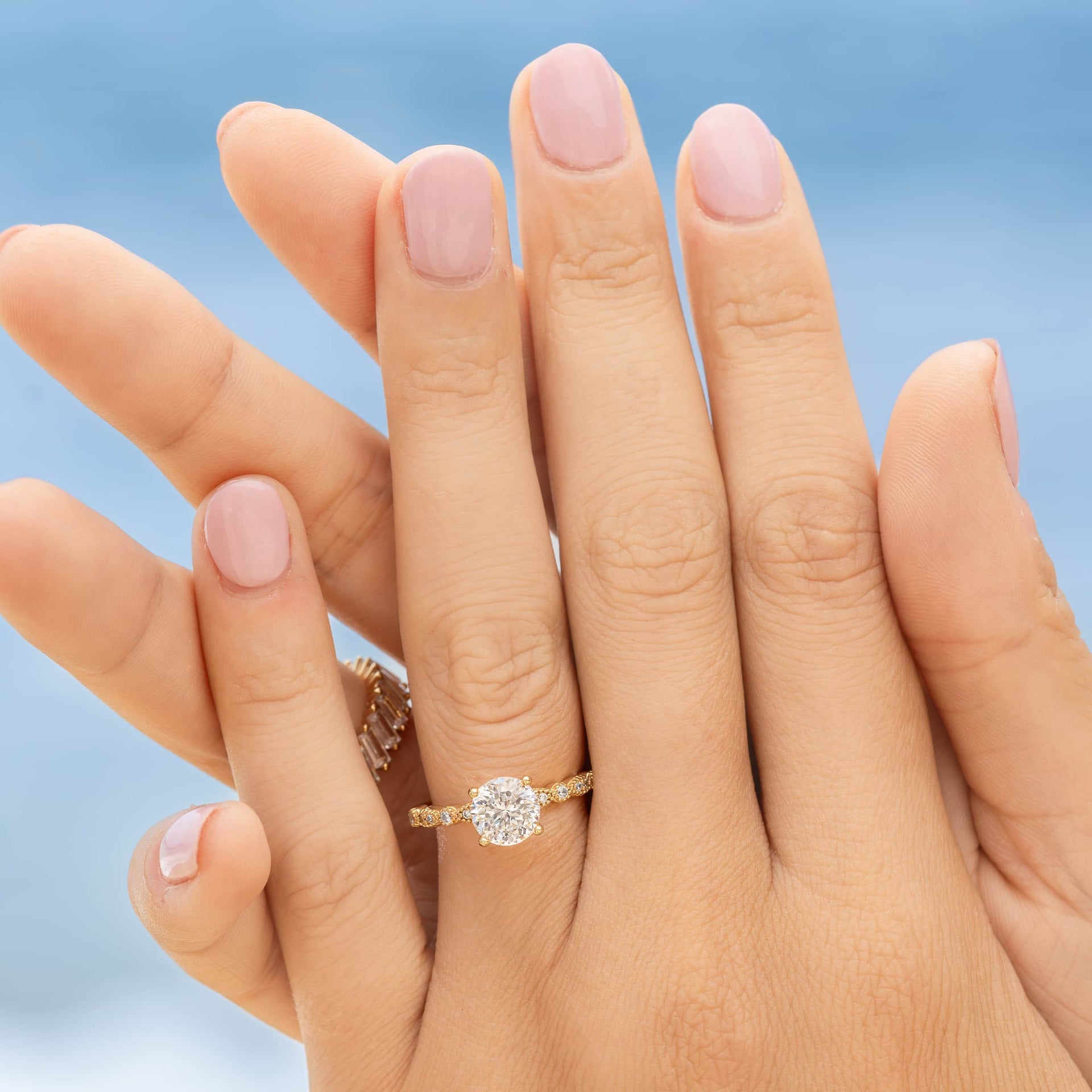 woman wearing vintage engagement ring in gold