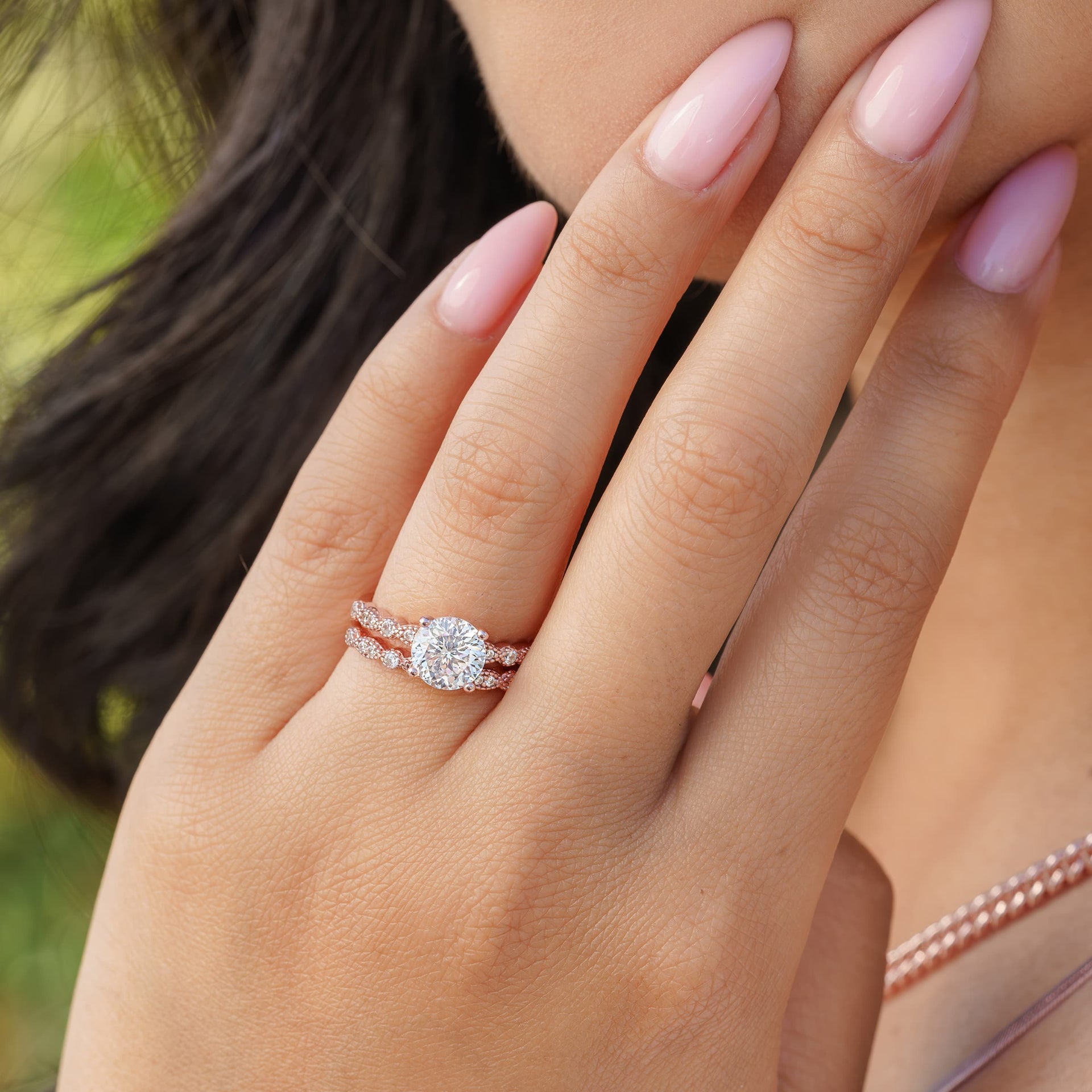 woman wearing vintage engagement ring with vintage wedding band