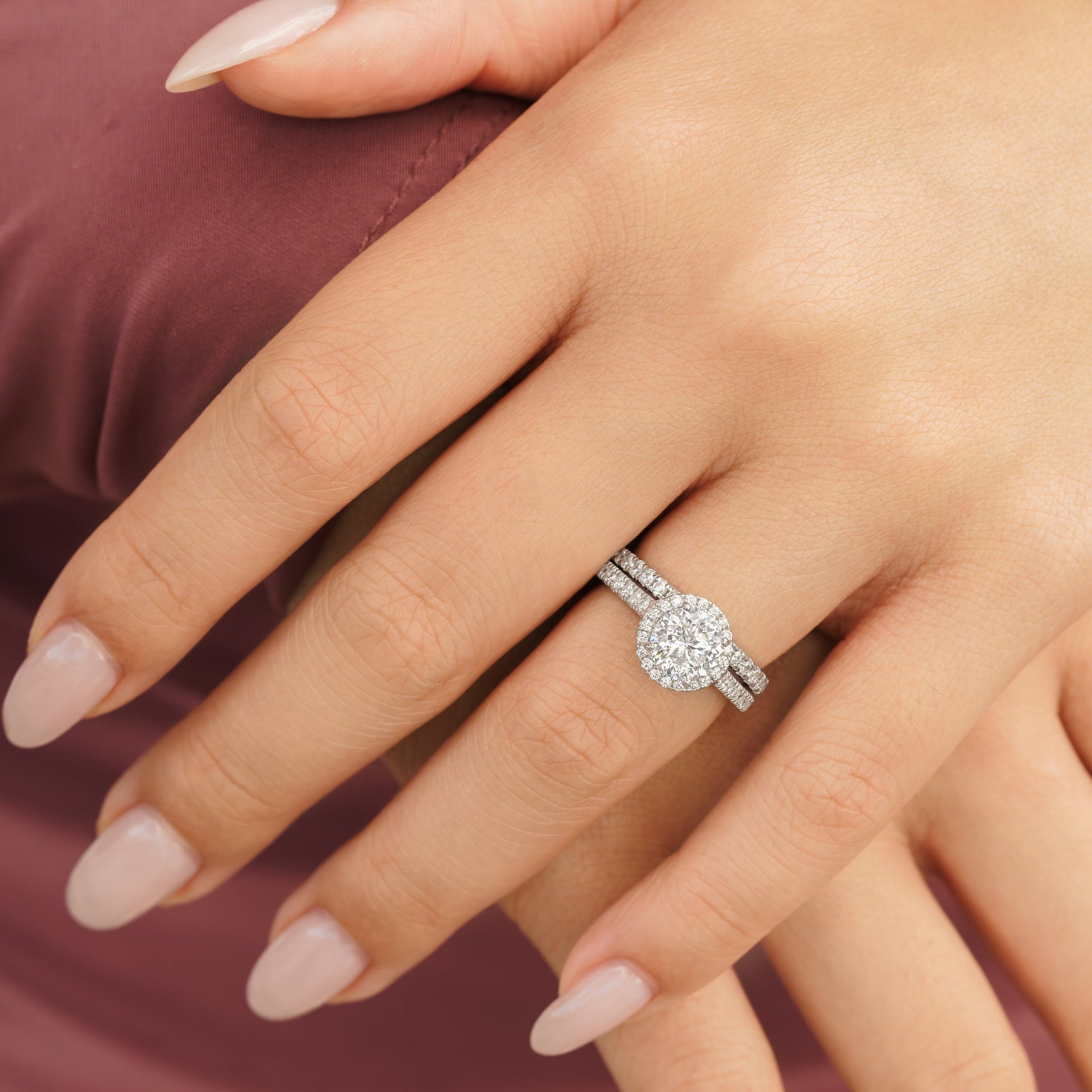 woman wearing rose wedding ring set in silver on hand