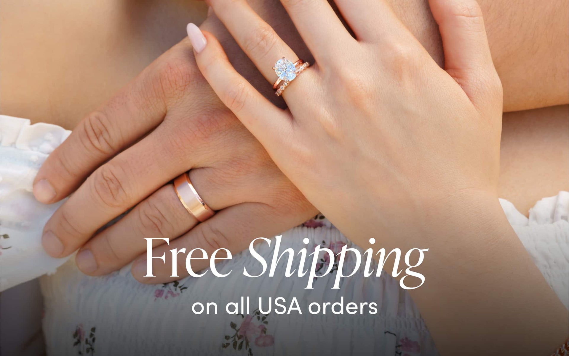 couple holding hands wearing rose gold wedding ring set
