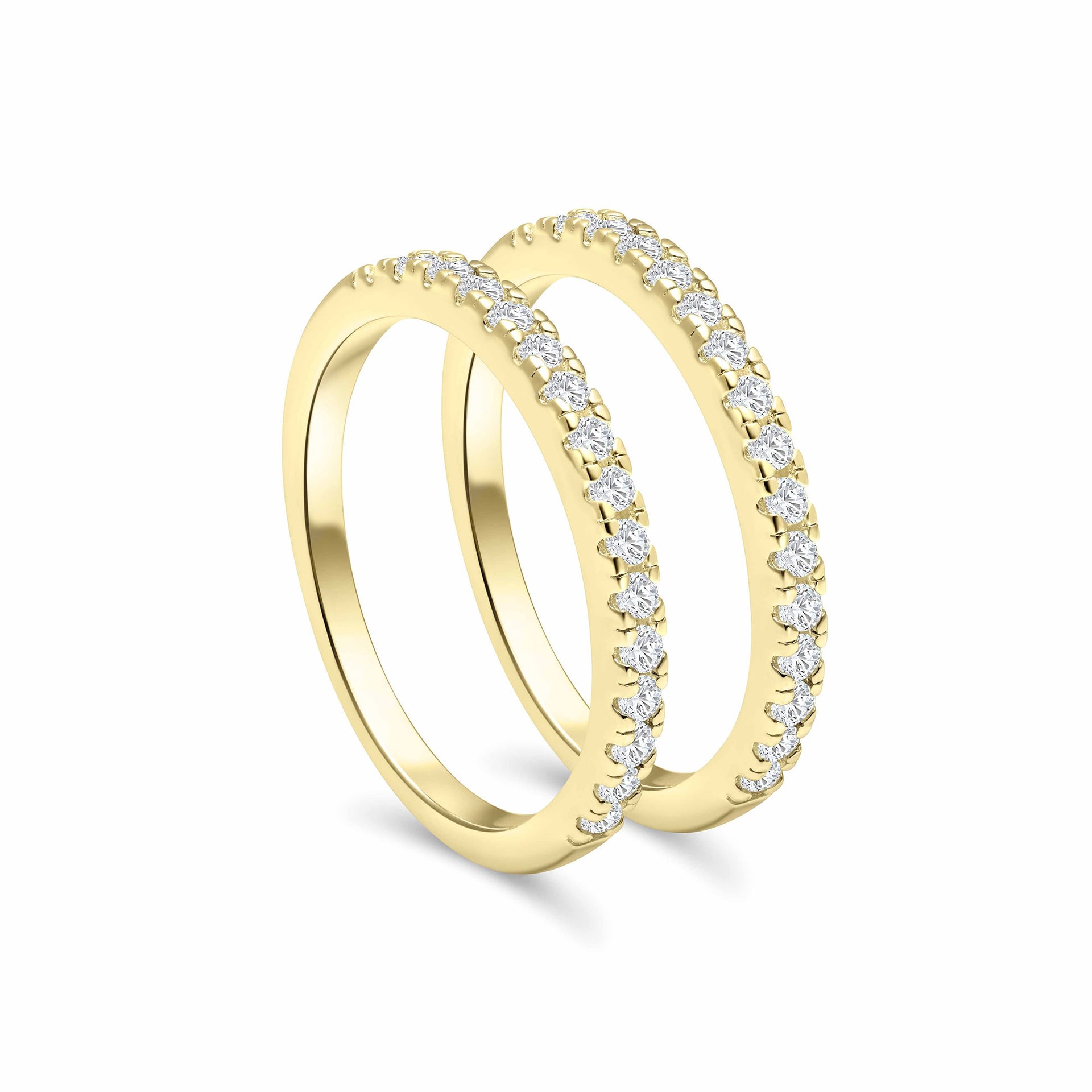 two standing half eternity wedding bands shown in gold as a stacking set