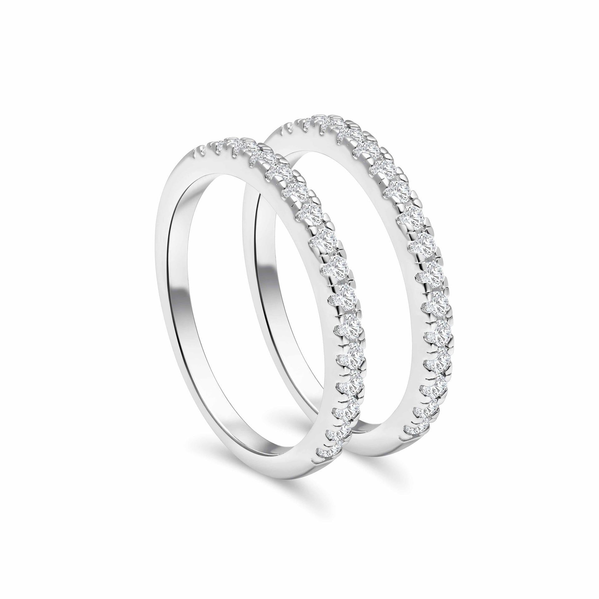 two standing half eternity wedding bands shown in silver as a stacking set