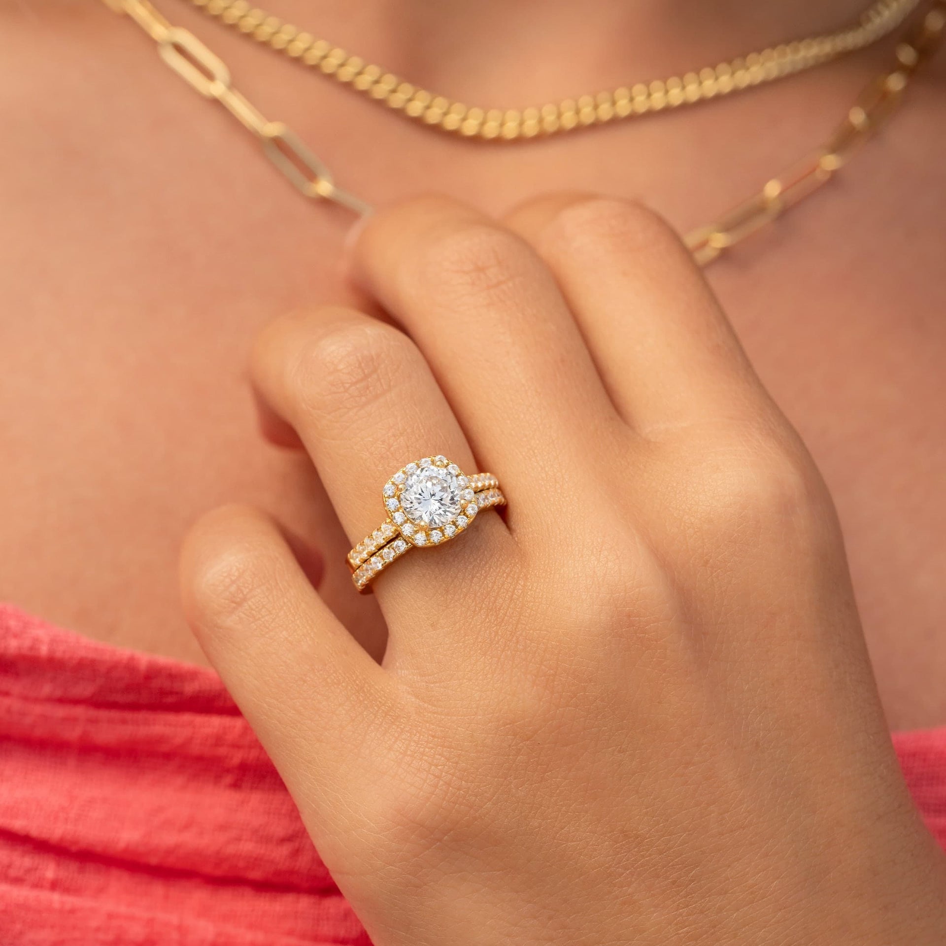 woman wearing gold wedding ring set