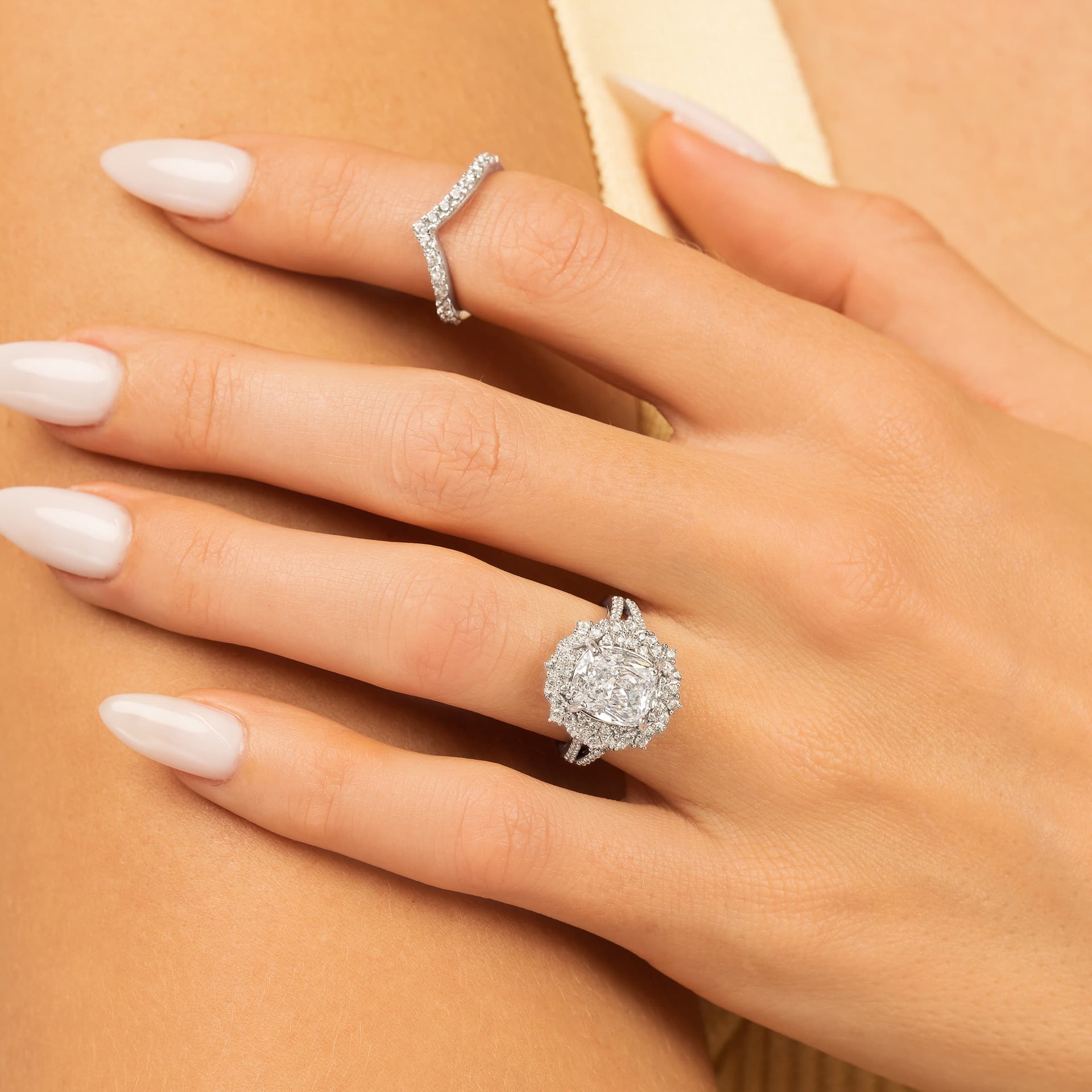 woman wearing vintage engagement ring with zoey wedding band