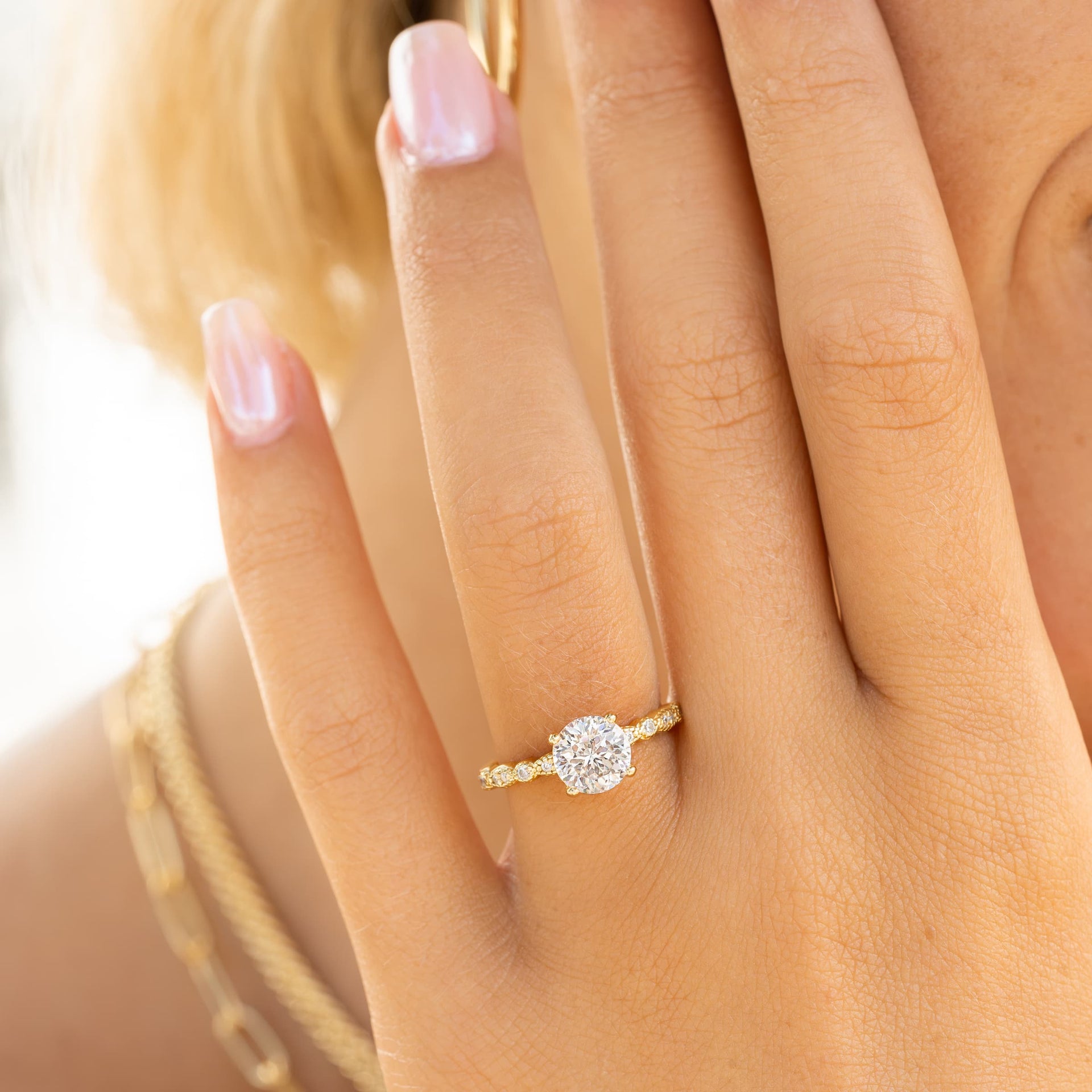 woman wearing round shaped vintage engagement ring