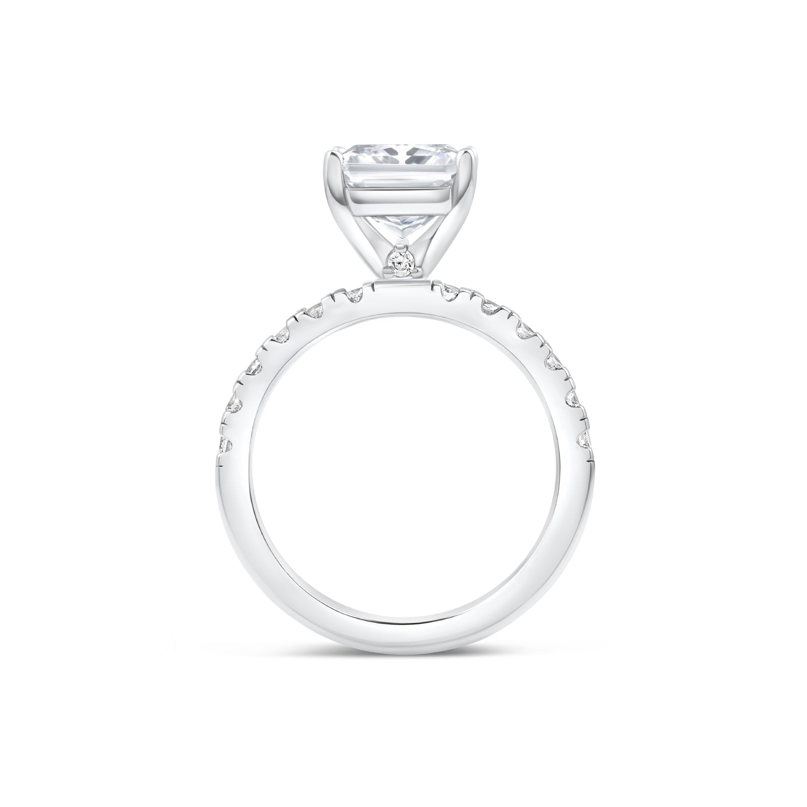 Band view of sleek silver radiant cut engagement ring with dainty stone detailing under its setting and a half eternity band