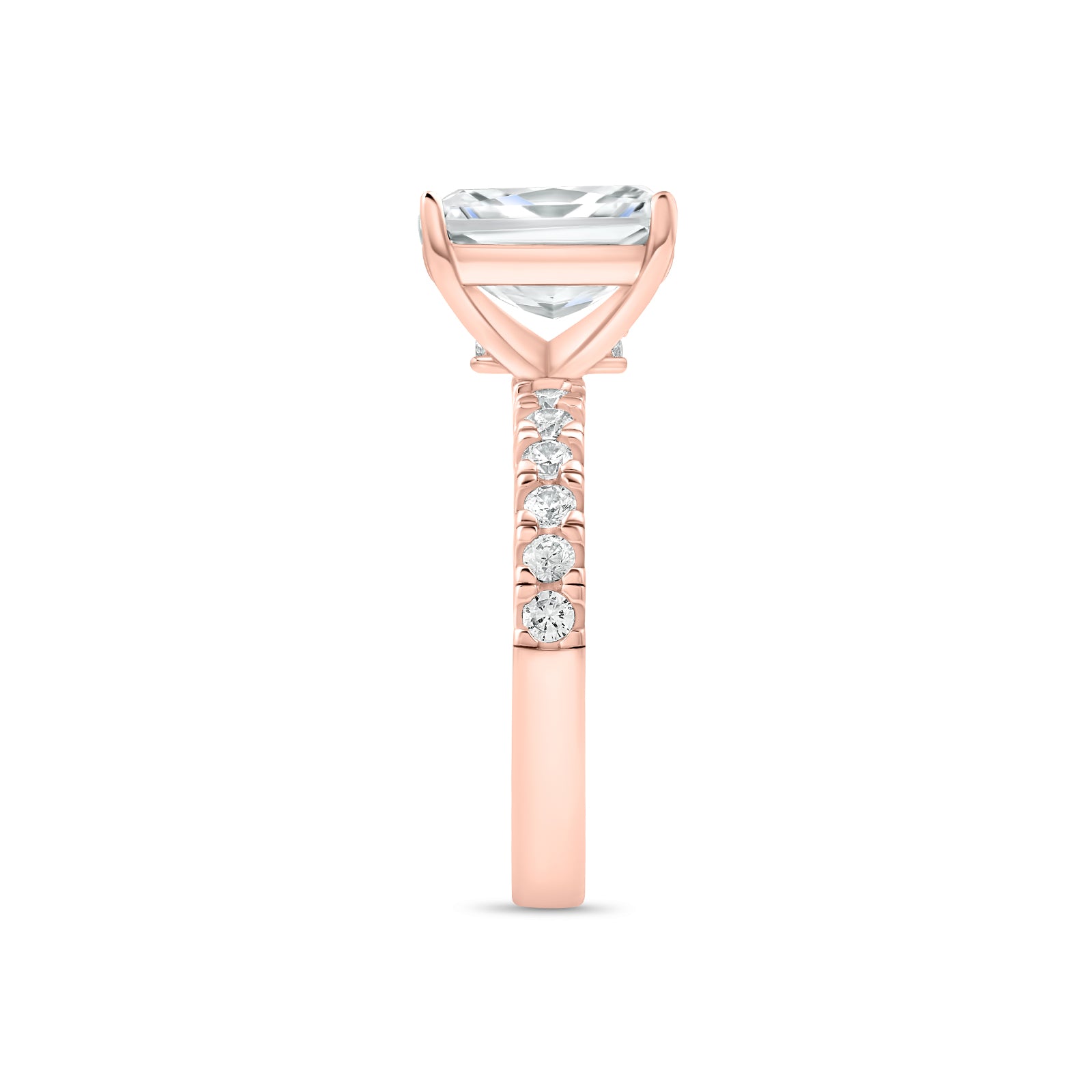 Side profile of rose gold radiant cut engagement ring with half eternity band detailing