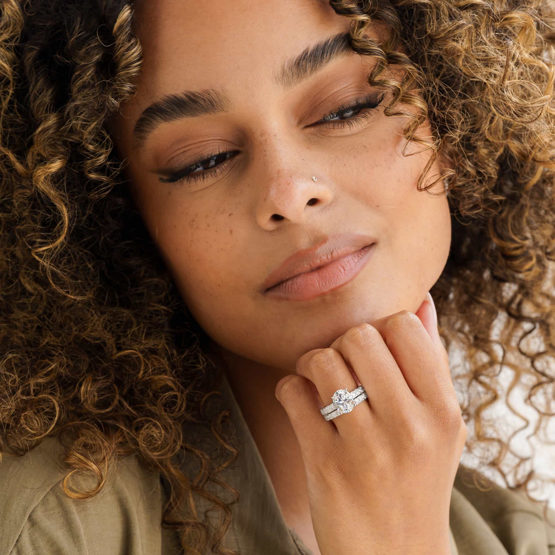 gorgeous model wearing silver oval engagement ring