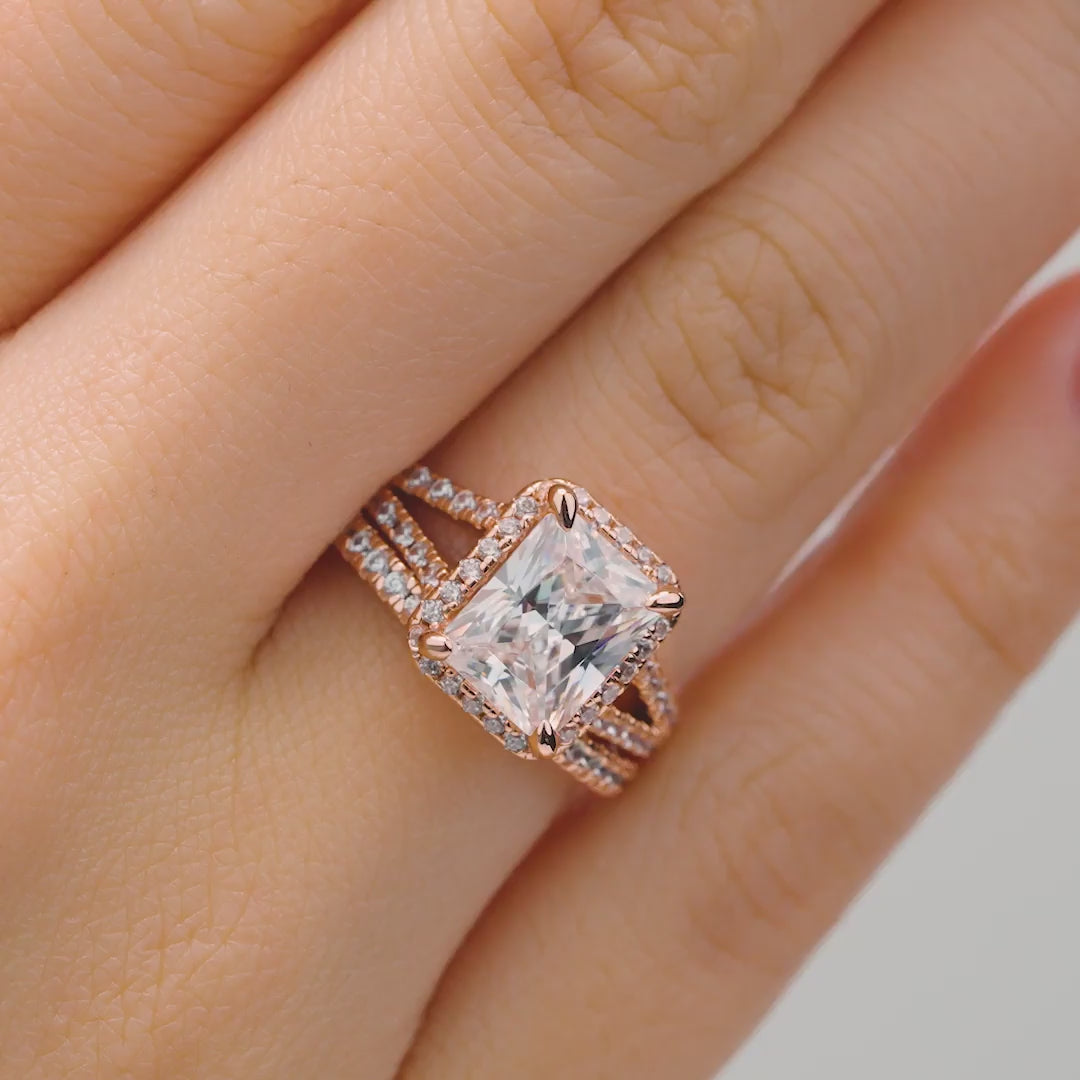 shiny rose gold wedding ring set with halo and split shank detailing on female hand