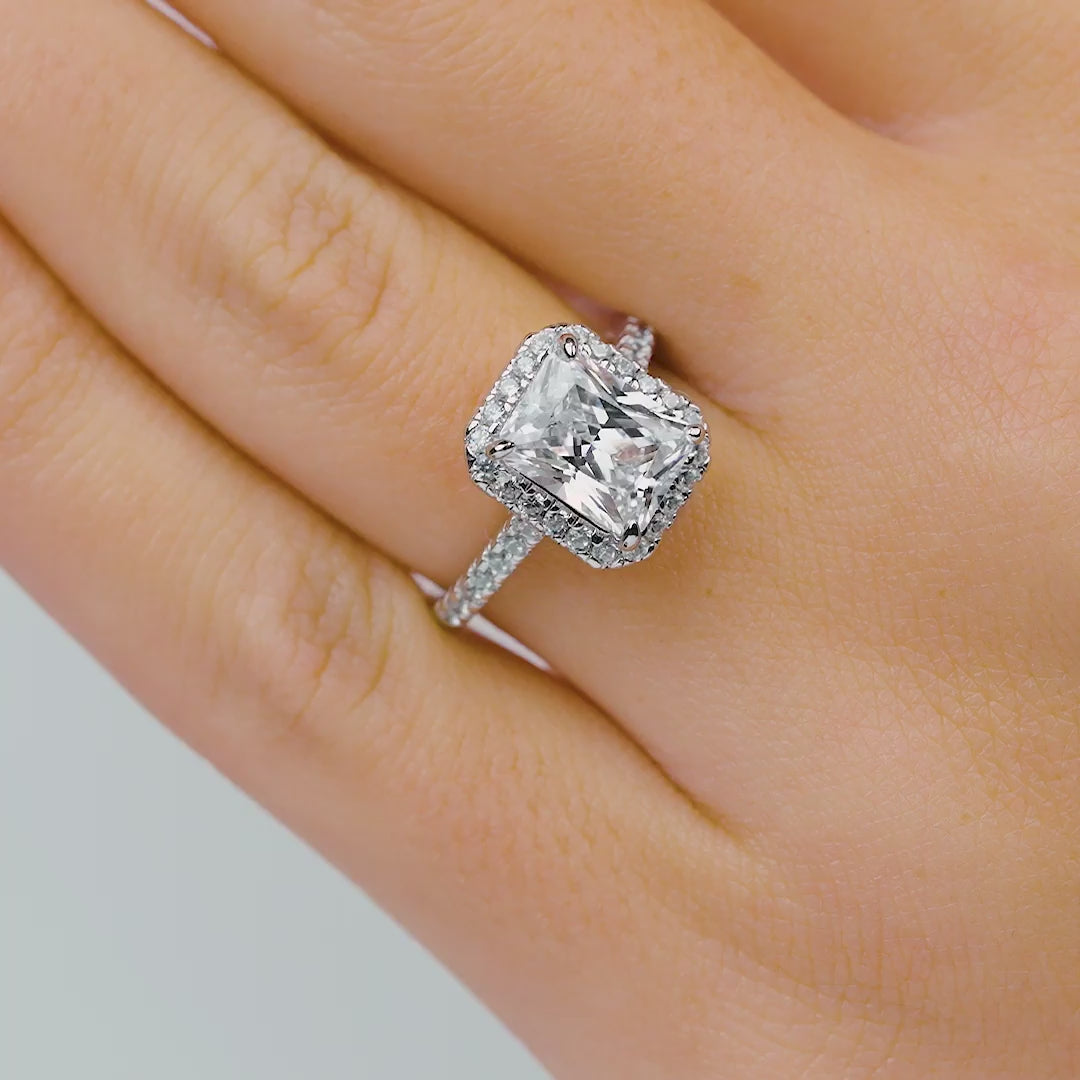 stunning radiant cut engagement ring modeled in female hands