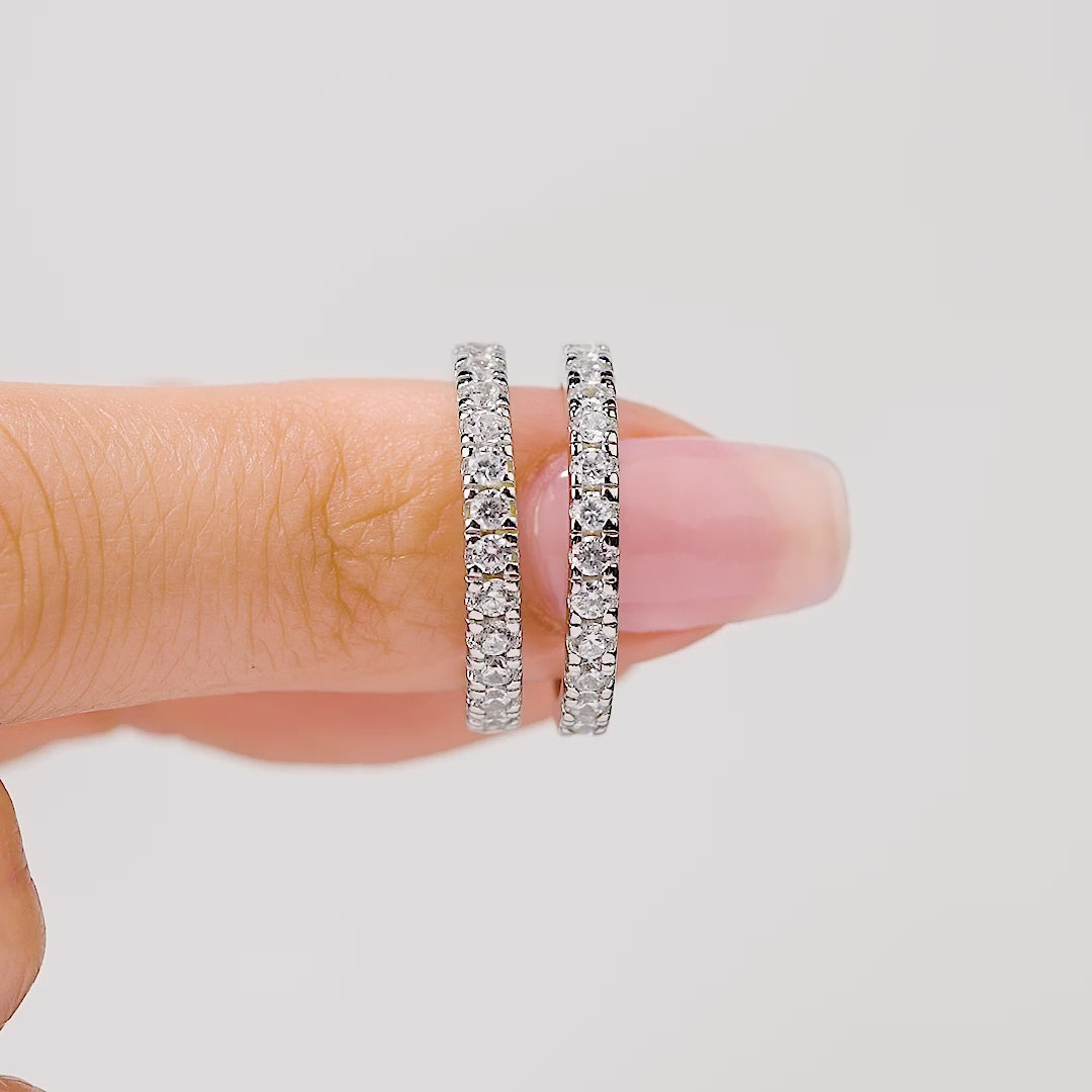 short video showcasing a silver eternity band wedding set at multiple angles and paired with an oval cut engagement ring