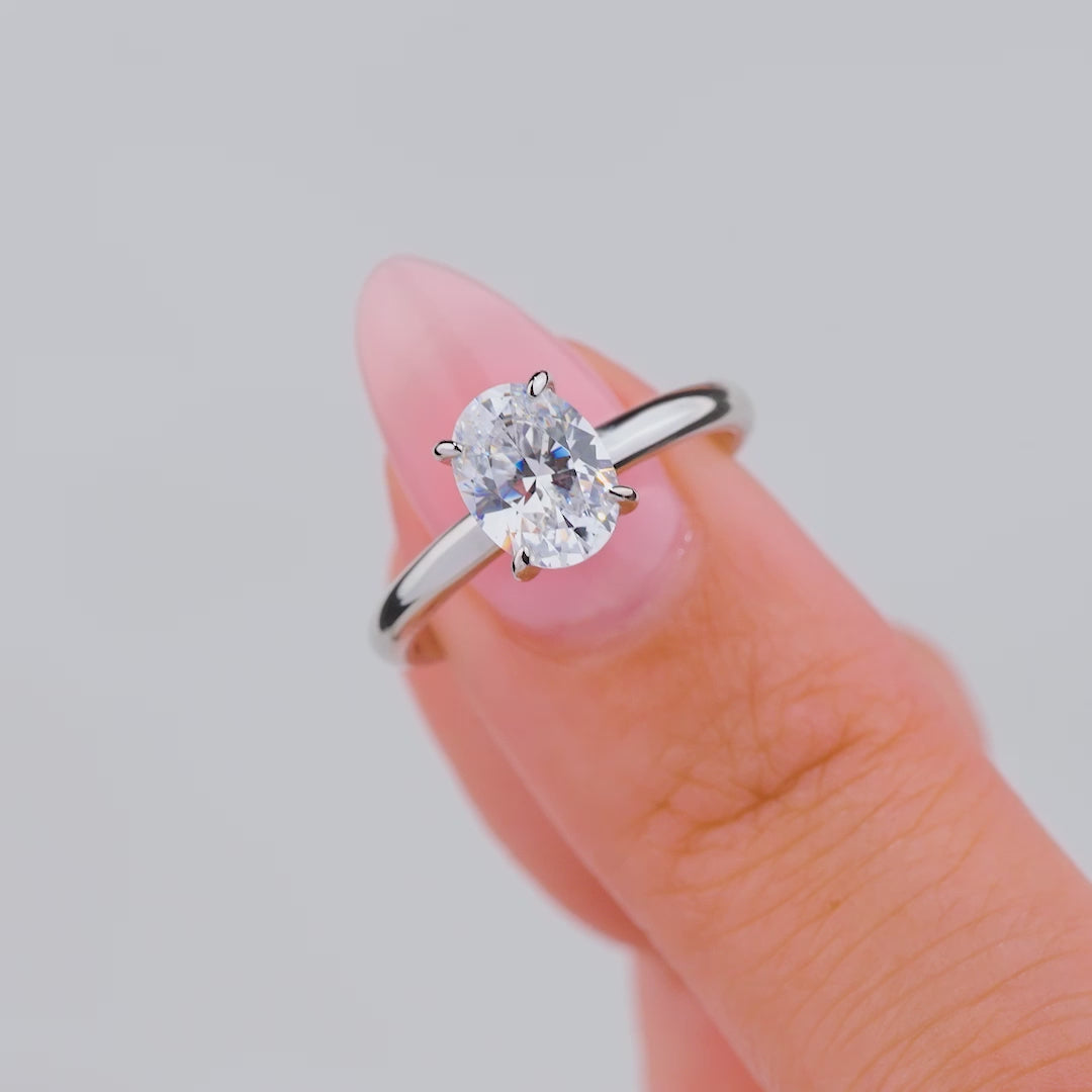 video of stunning oval cut solitaire on female model