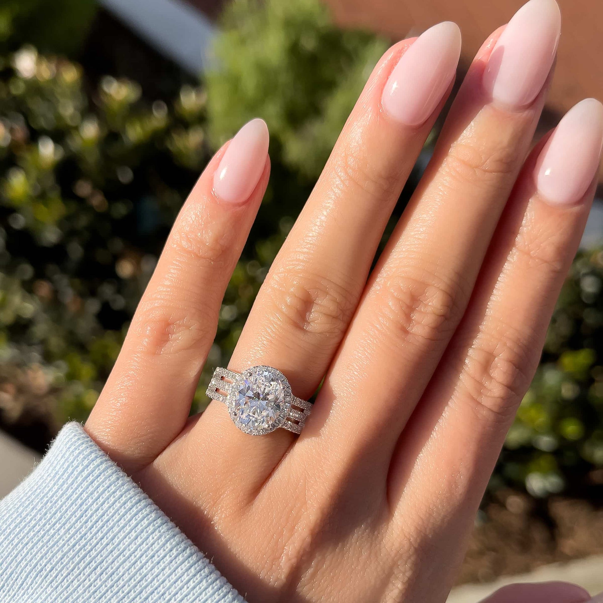 silver queen engagement ring on ladies hand