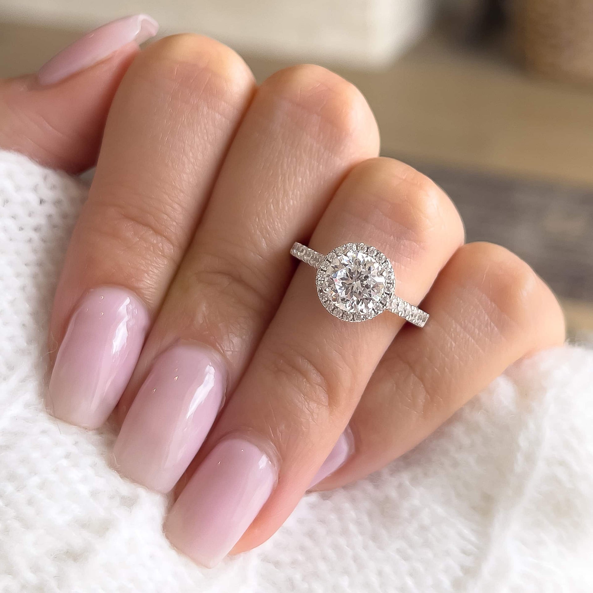 silver round cut wedding ring set on ladies finger