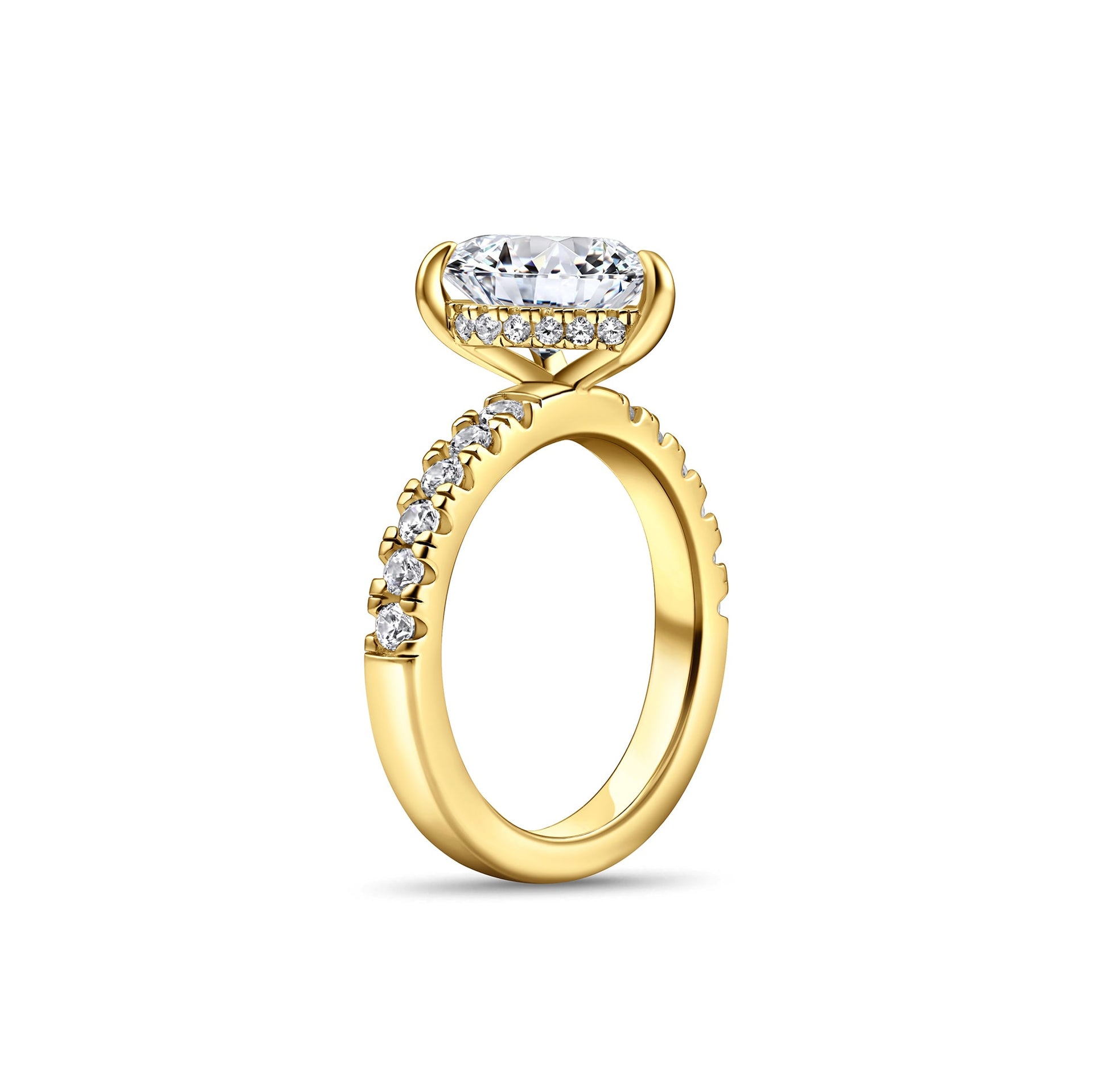 side view of gold 3 carat pear cut engagement ring with half eternity band detailing